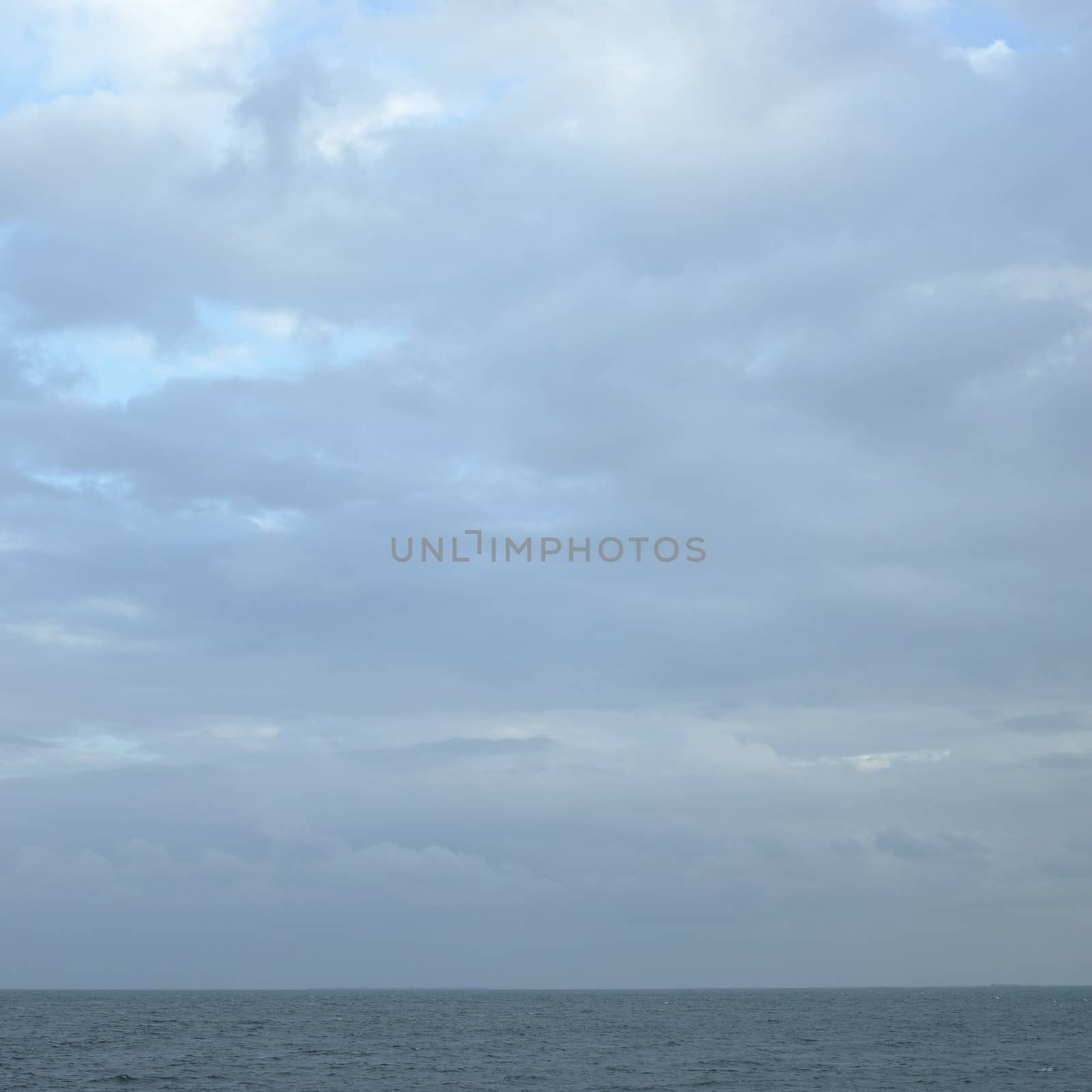 Turquoise ocean and dark sky