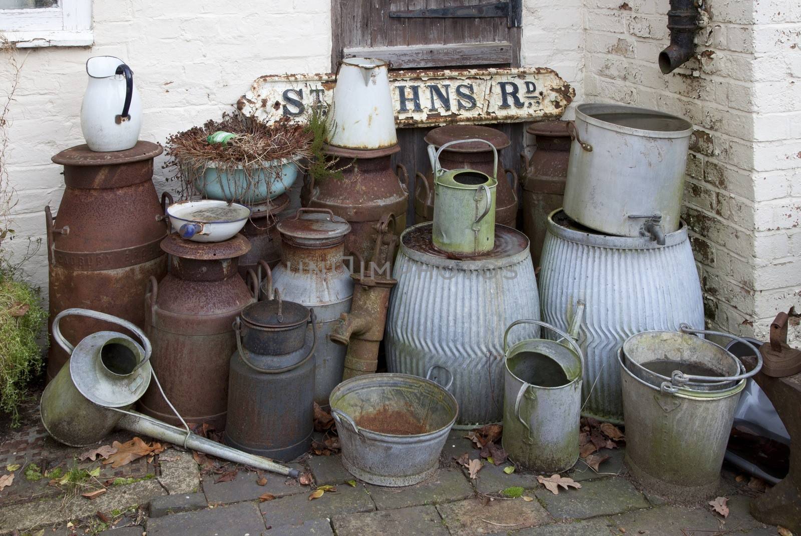 Old metal milk churns, watering cans, buckets etc, Warwickshire, England.