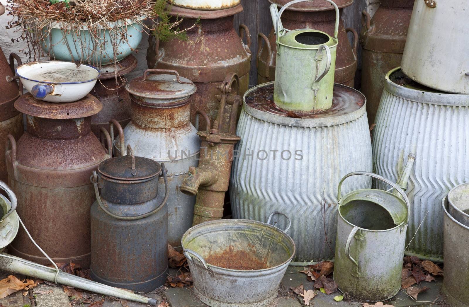 Old metal milk churns, watering cans, buckets etc, Warwickshire, England.