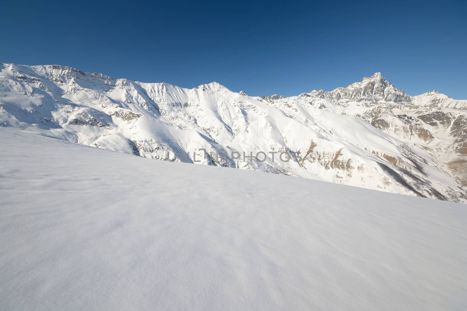 Winter mountainscape and superb frontal view on the majestic M. Viso (3841 m), Po Valley, Piedmont