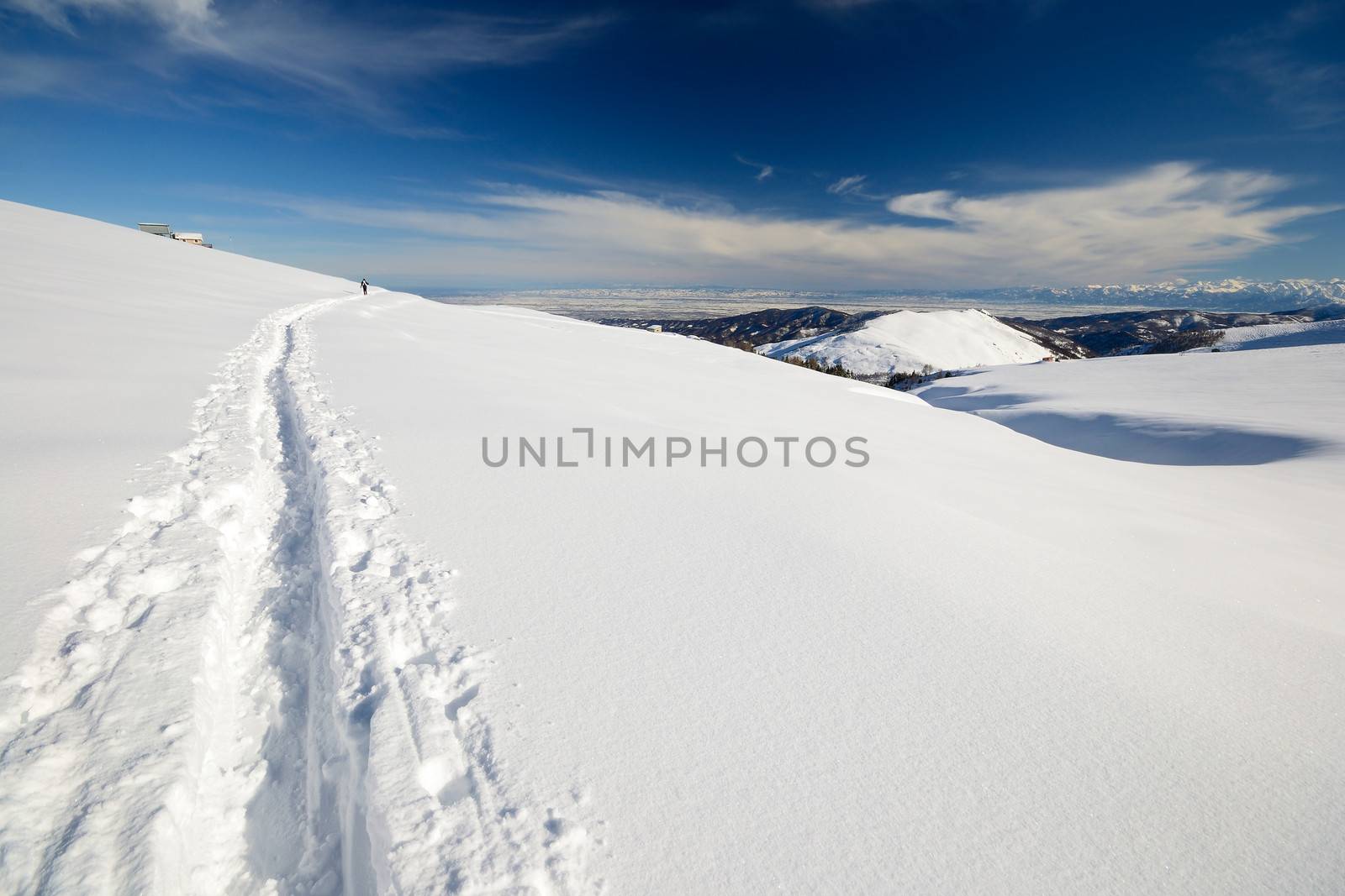 Ski touring (back country skiing) in majestic high mountain scenery, italian Alps