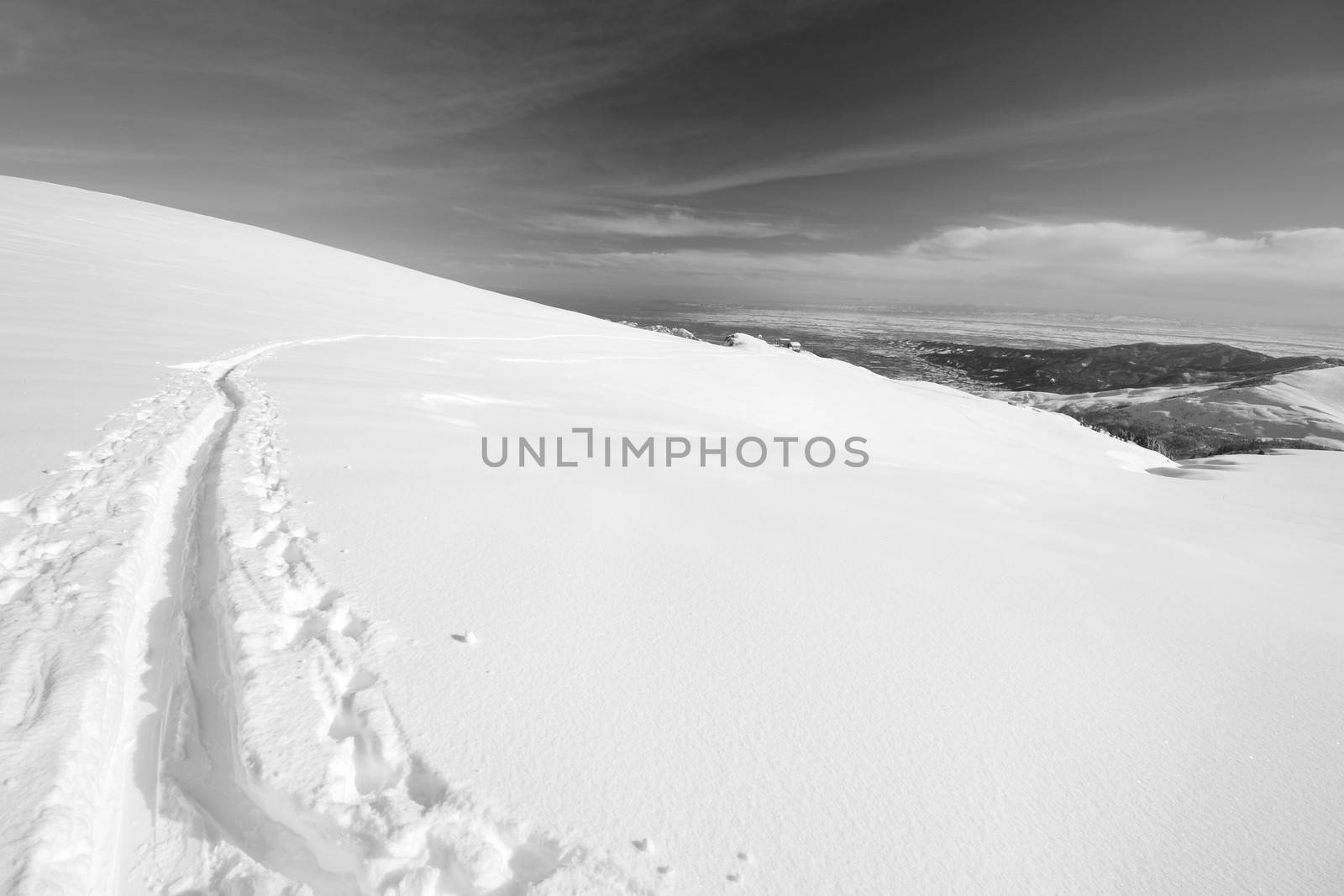 Ski touring (back country skiing) in majestic high mountain scenery, italian Alps