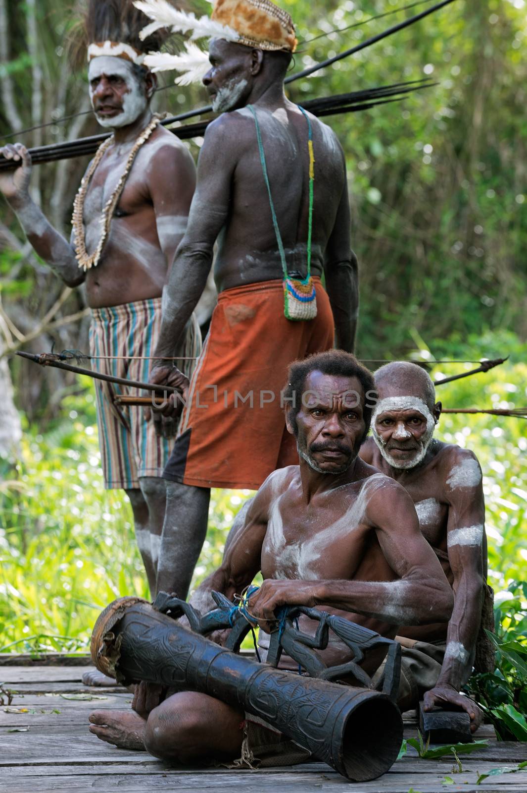  Asmat tribesman with drum. by SURZ