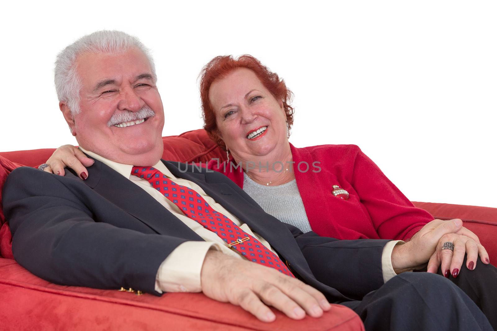 Caucasian senior couple smiling and holding hands by coskun