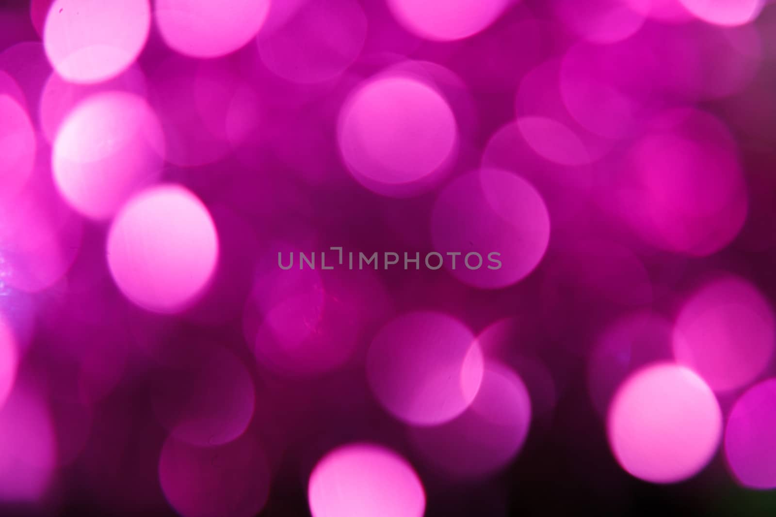 Abstract christmas background. Holiday colored lights unfocused