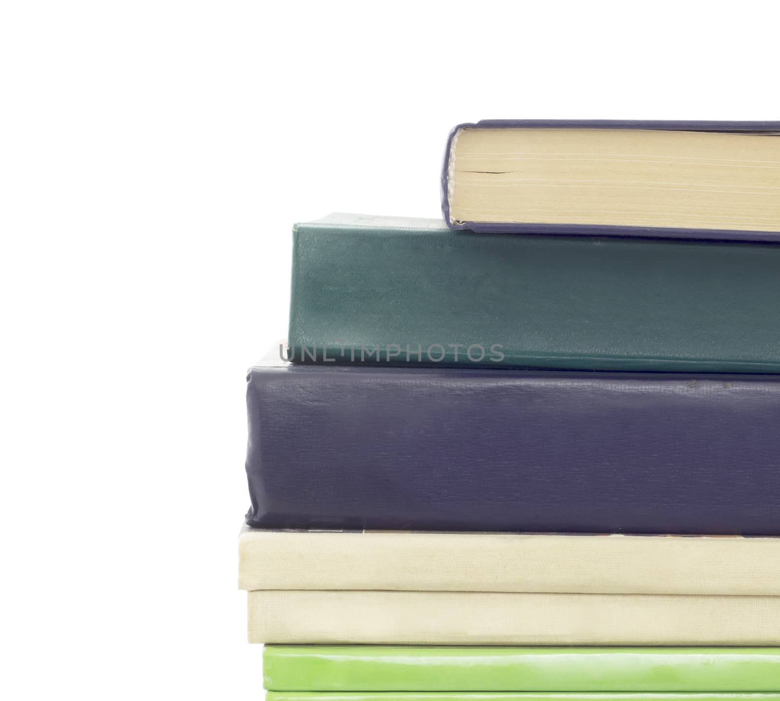 Stack of different old books with no labels. Isolated on white background