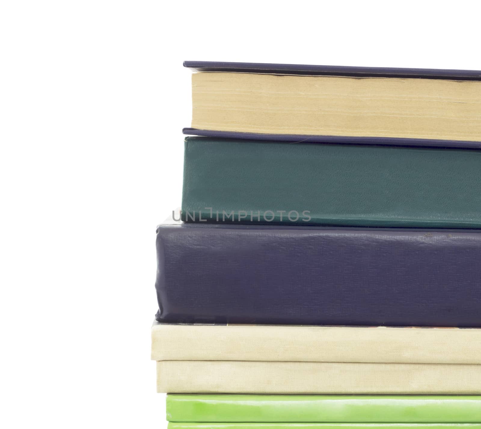 Stack of different old books with no labels. Isolated on white background
