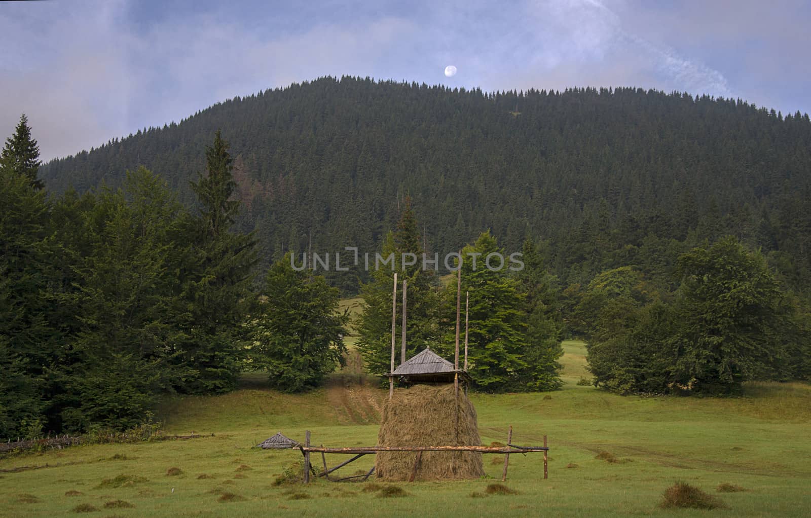 haystack against the mountain with the moon by Irene1601