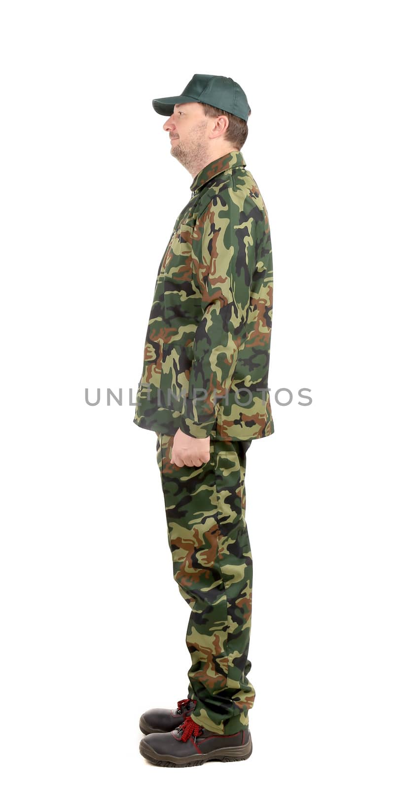 Man in military suit. Side view. Isolated on a white background.
