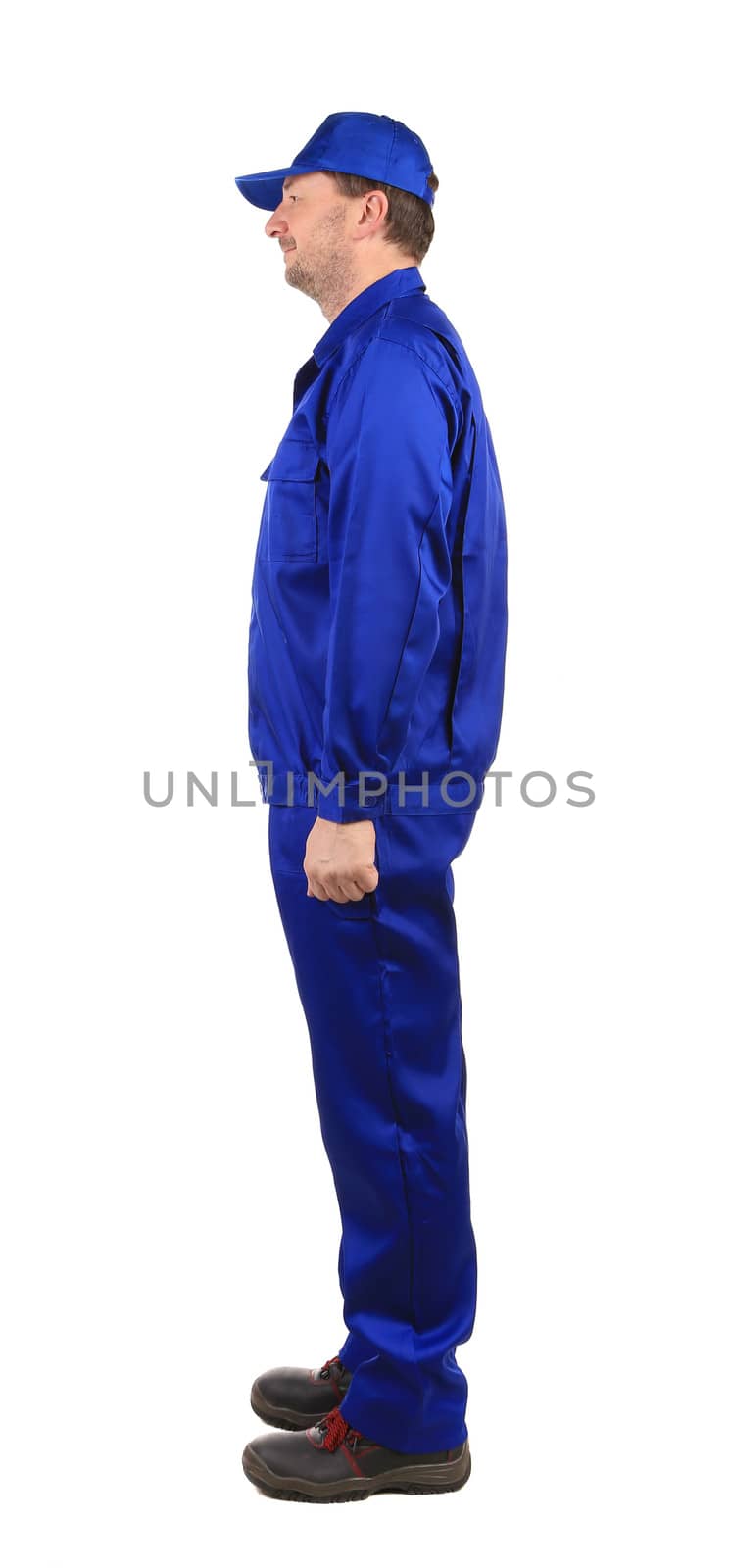 Worker in blue workwear. Side view. Isolated on a white background.