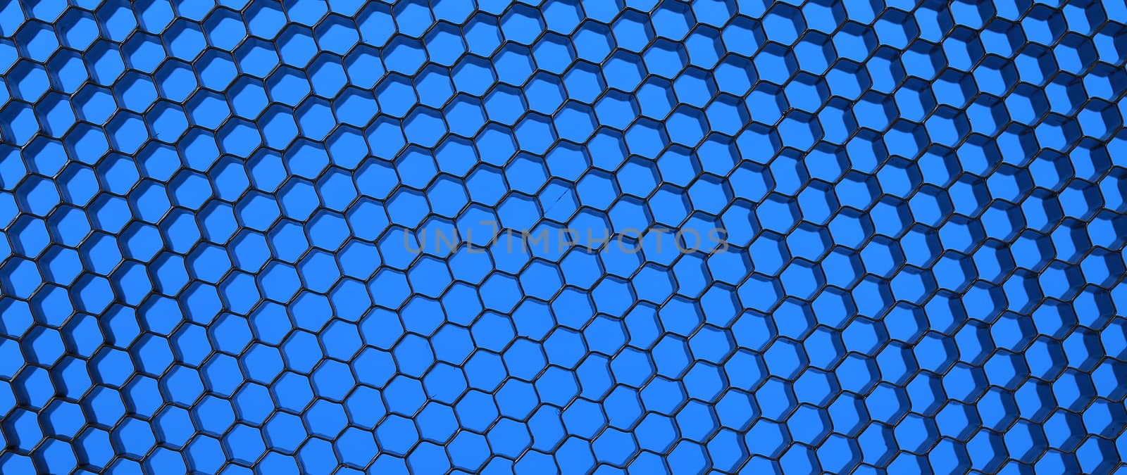 Close up of black net. Blue light. Whole background.
