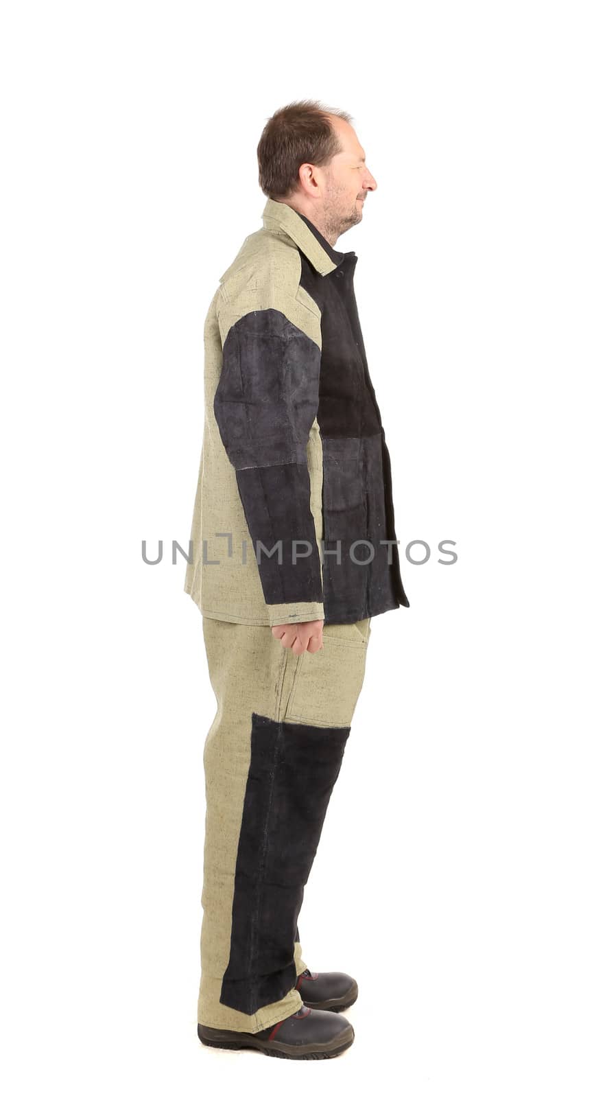 Welder in workwear suit. Side view. Isolated on a white background.