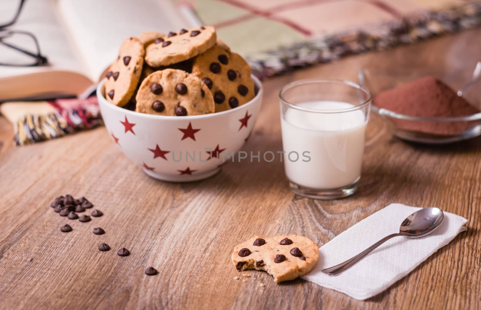 Chocolate chip cookies and milk on wood background by doble.d