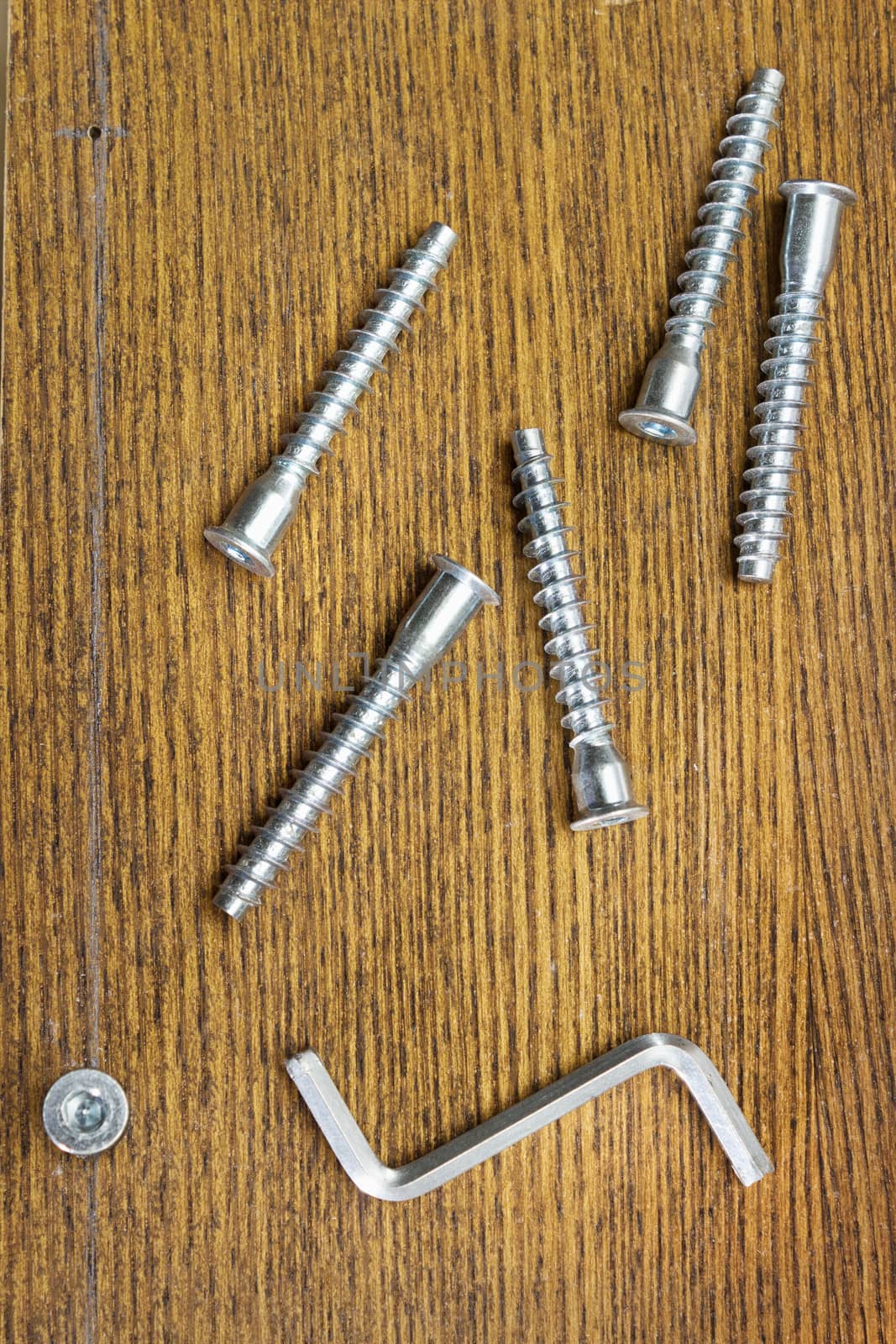 Screws for assembling furniture and simple tool on table