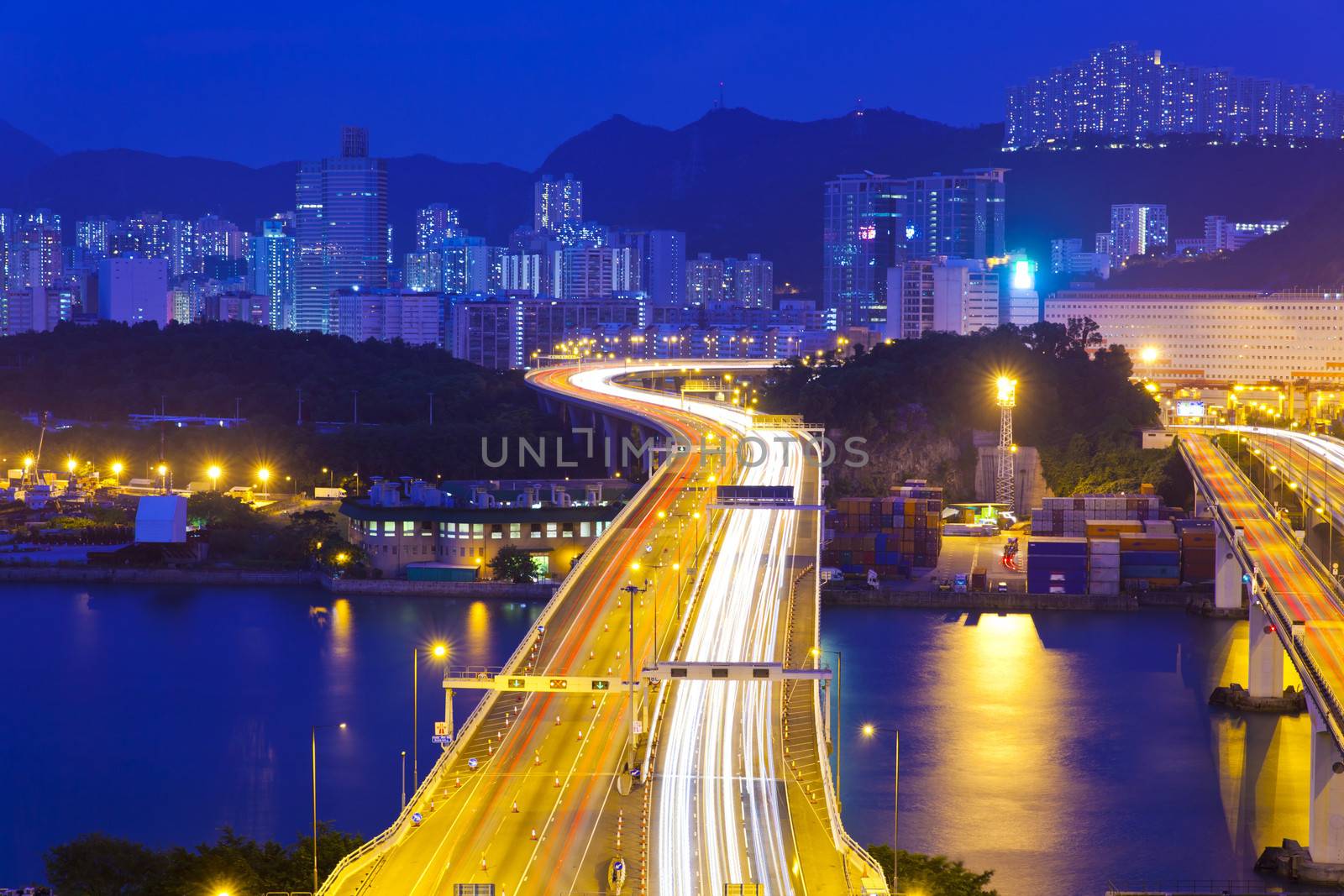 Modern highway in city at night by kawing921