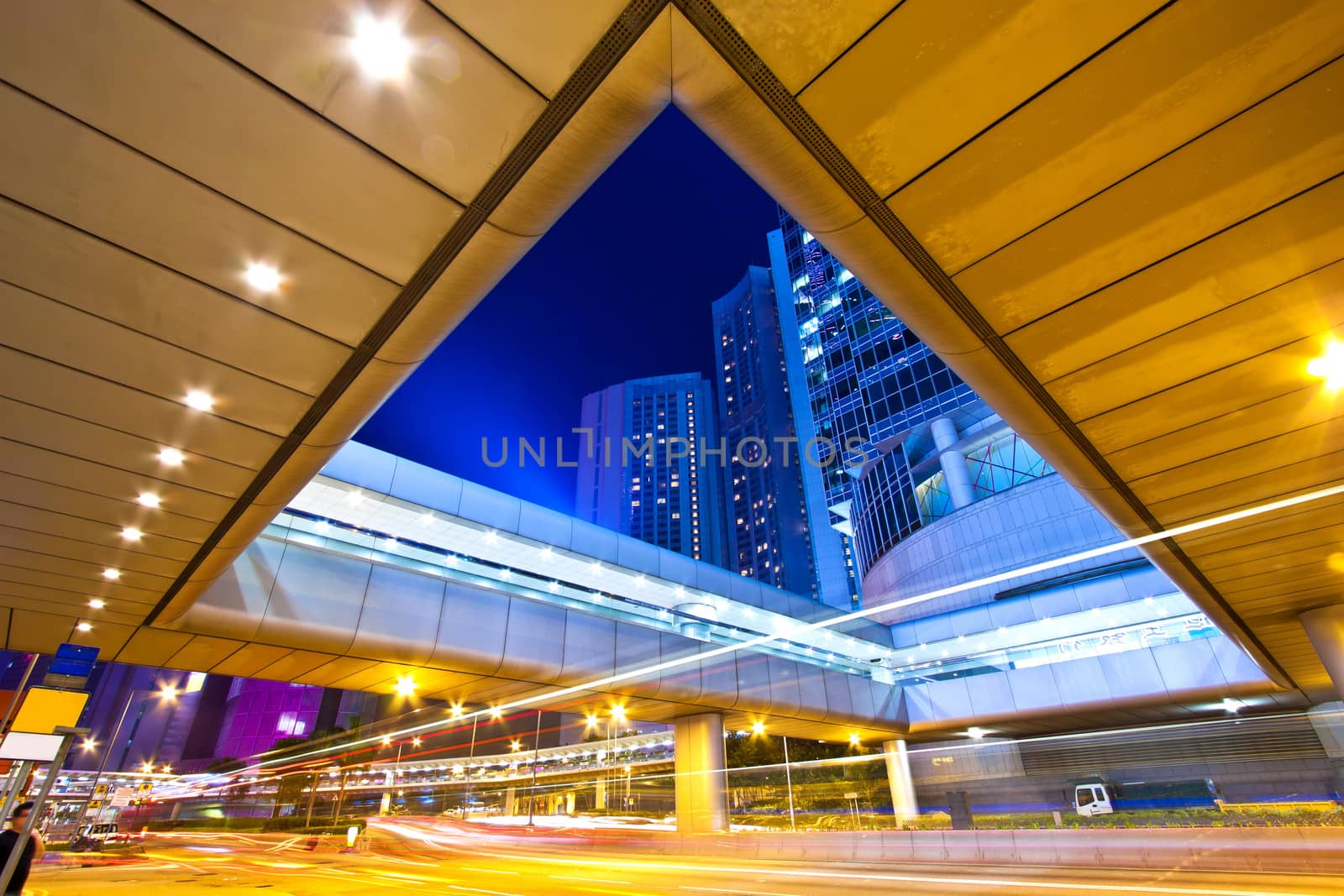 The light trails on the modern buildings background in Hong Kong