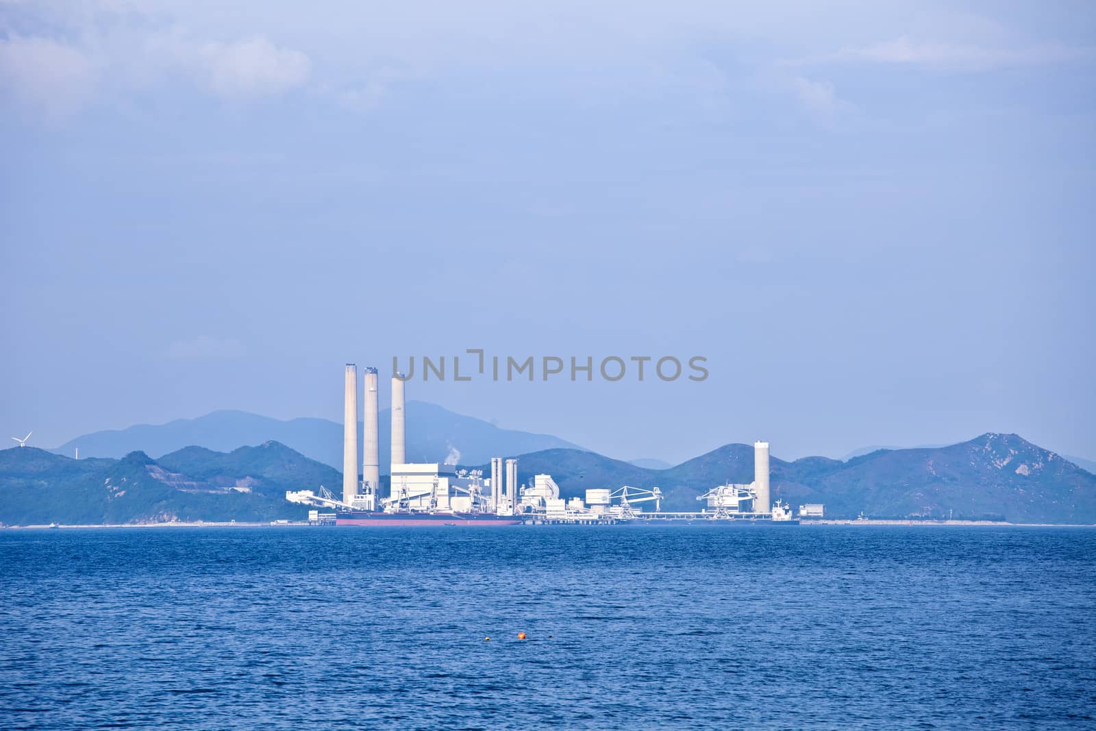 Power plant at day along coast by kawing921