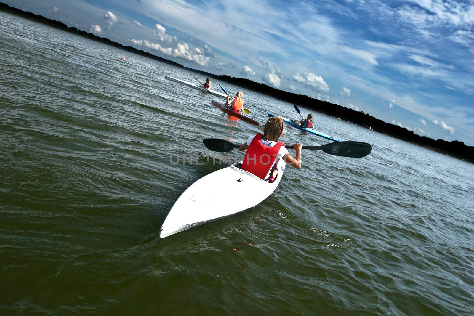 Young people on kayak in denmark on a lake