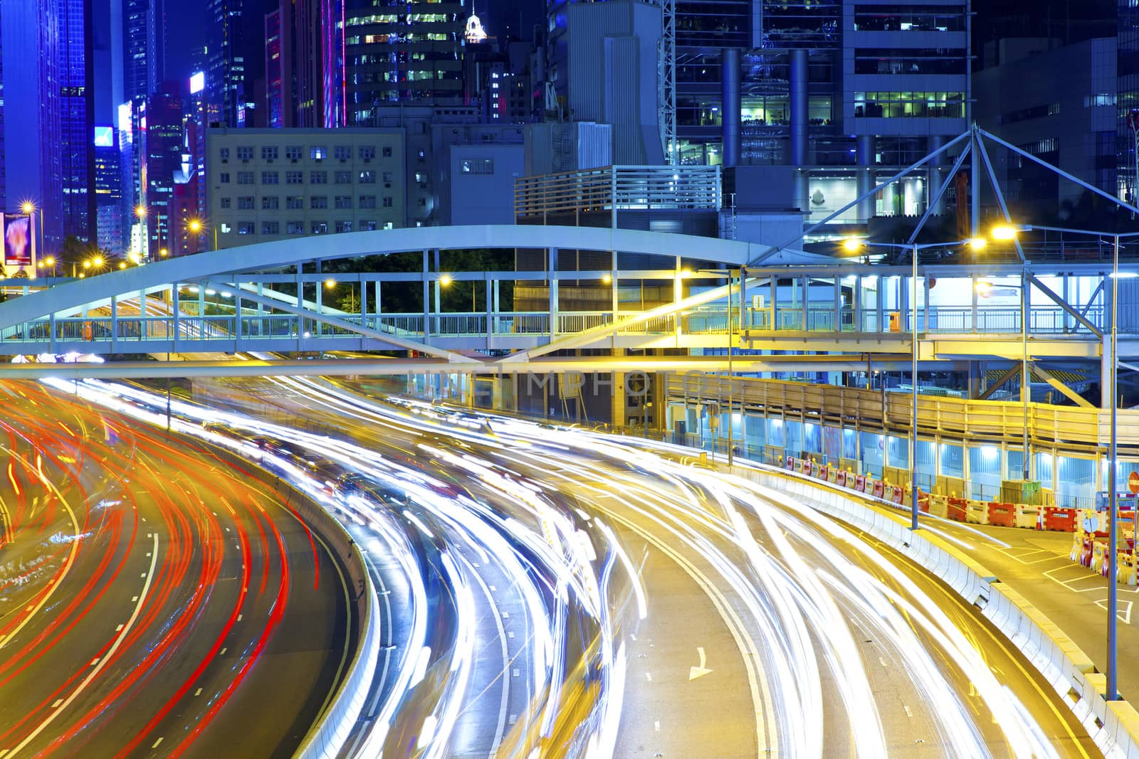 Traffic light curving lines on road during rush hour by kawing921