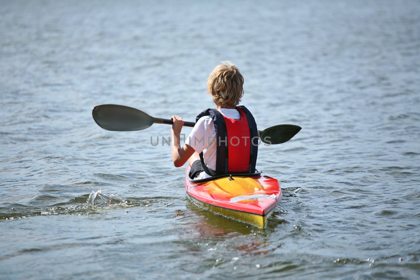 Young people on kayak in denmark on a lake