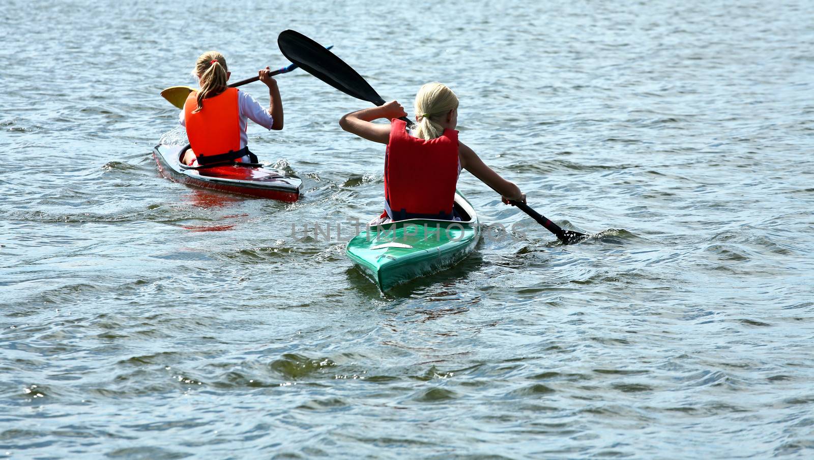 Young people on kayak in denmark on a lake