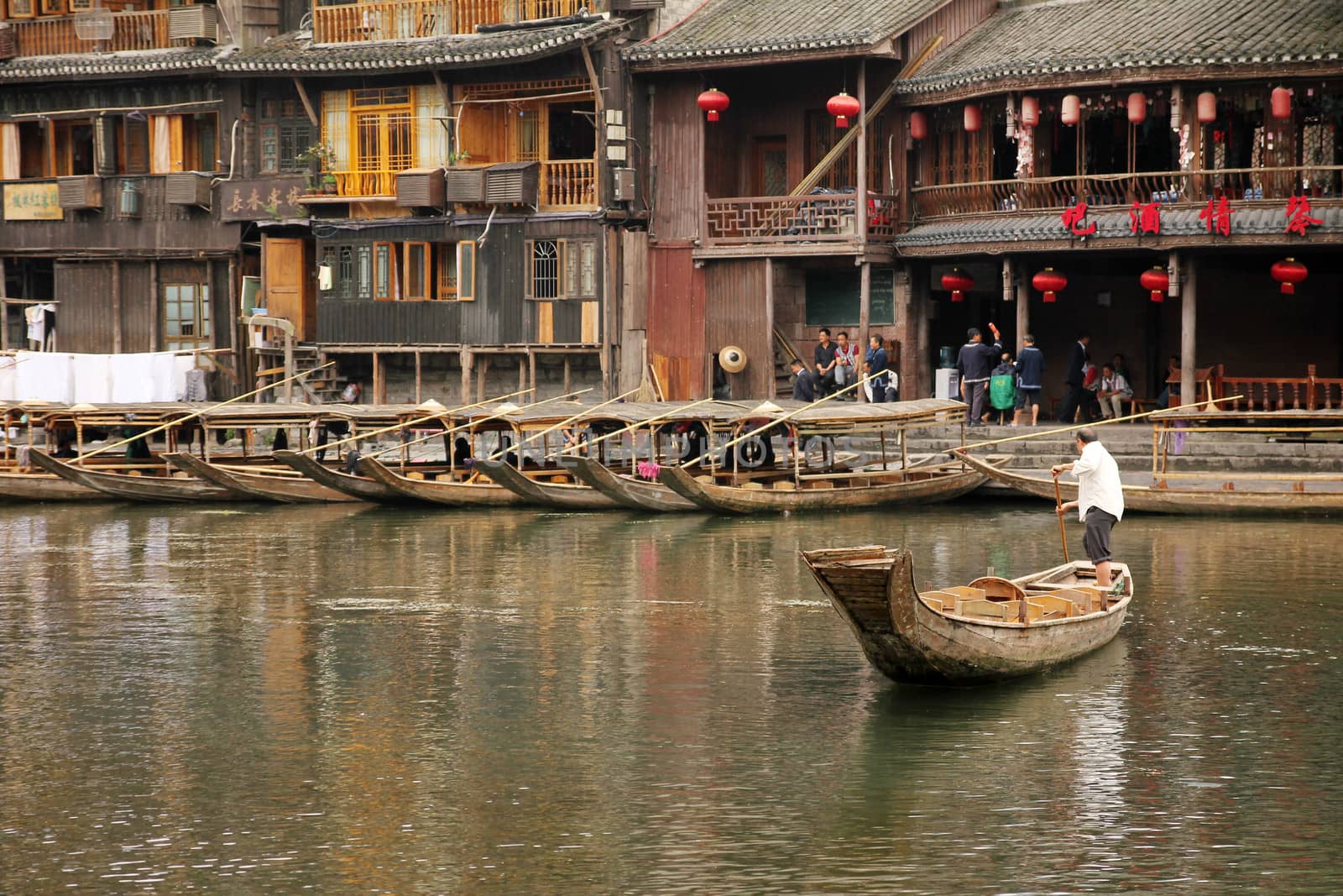 FENGHUANG- MAY 12: Tuojiang River on May 12, 2011 in Fenghuang, China. The ancient town of Fenghuang was added to the UNESCO World Heritage Tentative List in the Cultural category.