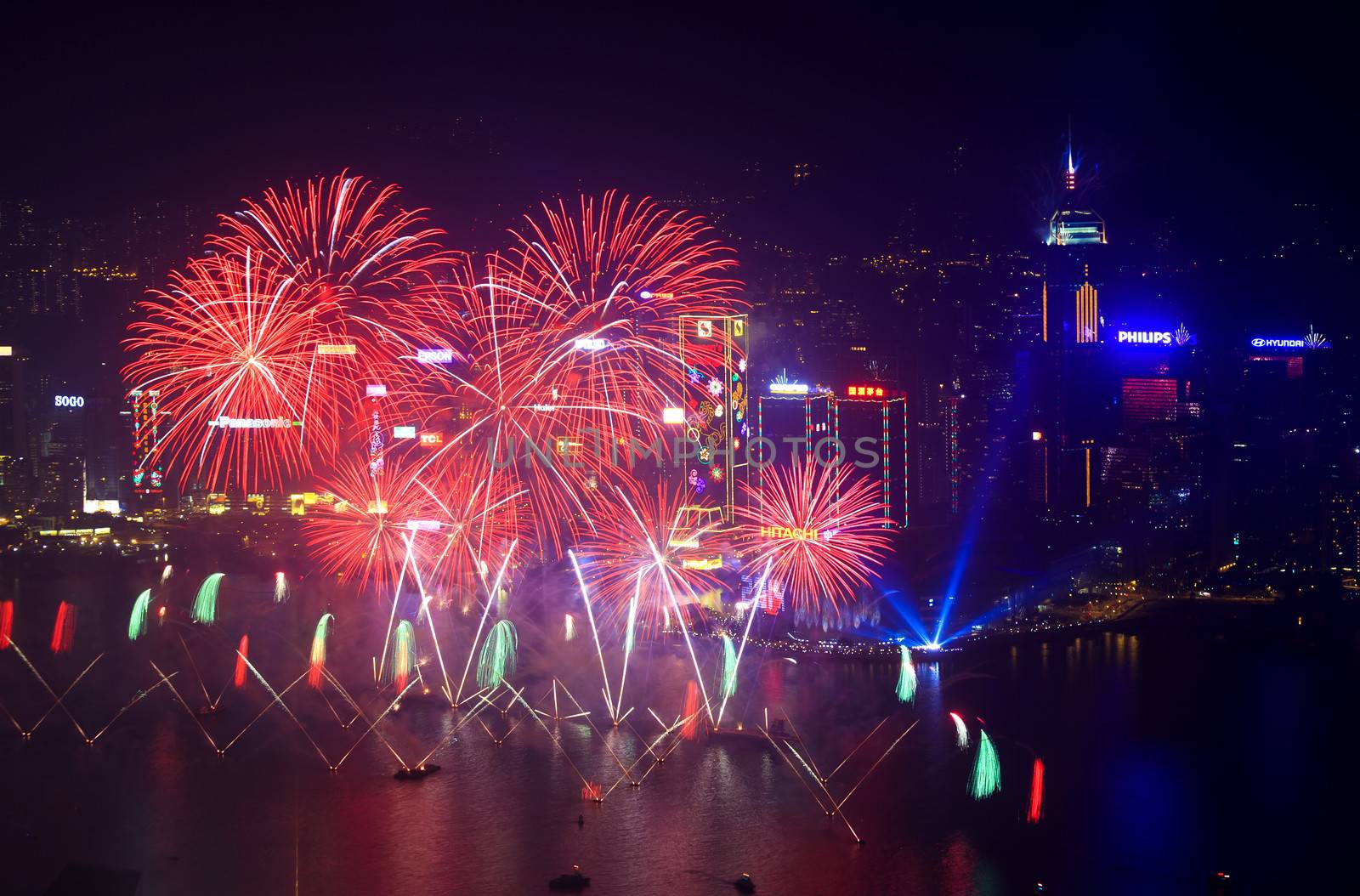 HONG KONG - 1 JANUARY: A splendid firework show and countdown celebration held in Hong Kong on 1 January, 2014. The show lasted for 8 minutes and lighted up the skies above Hong Kong skyscrapers.