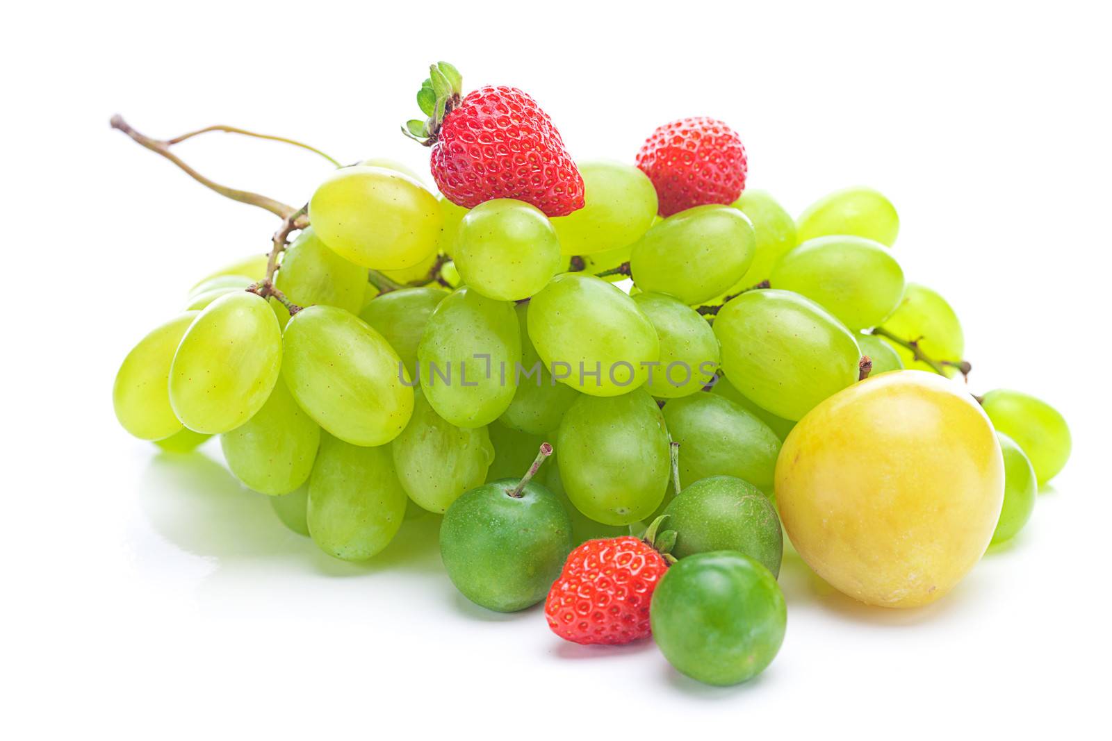 bunch of white grapes,plum and strawberries isolated on white