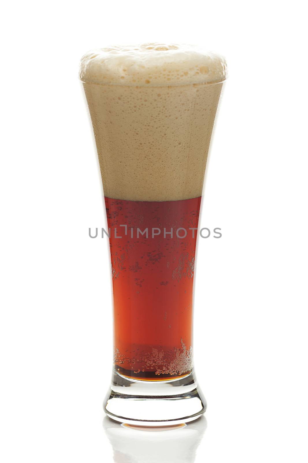 dark beer with the foam in a tall glass isolated on white by jannyjus
