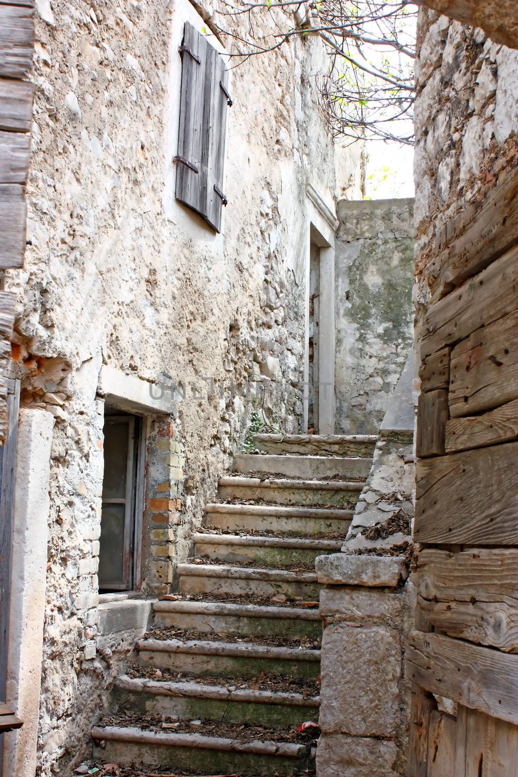 Retro image of old stone stairs and house