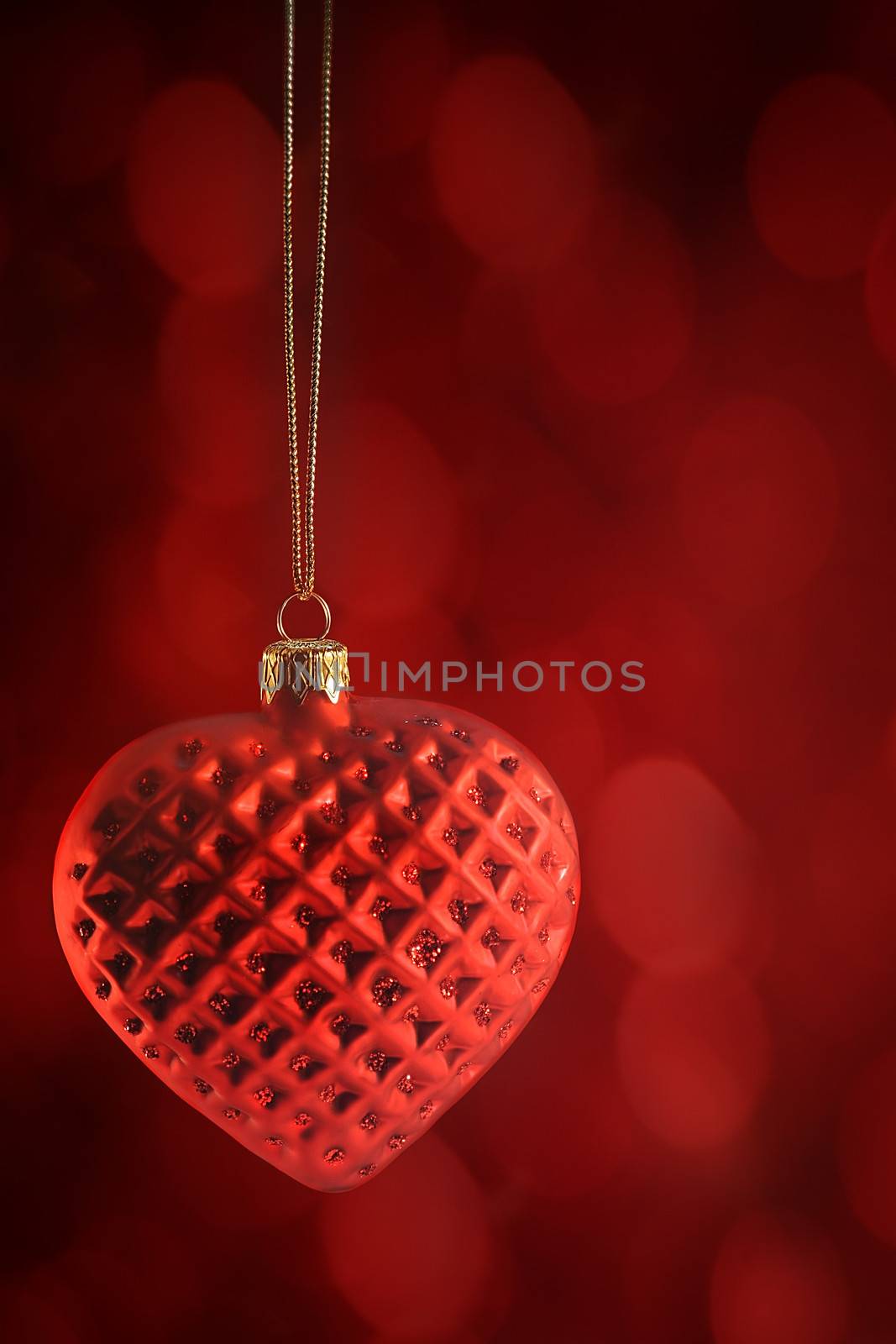 Red heart ornament hanging by Sandralise