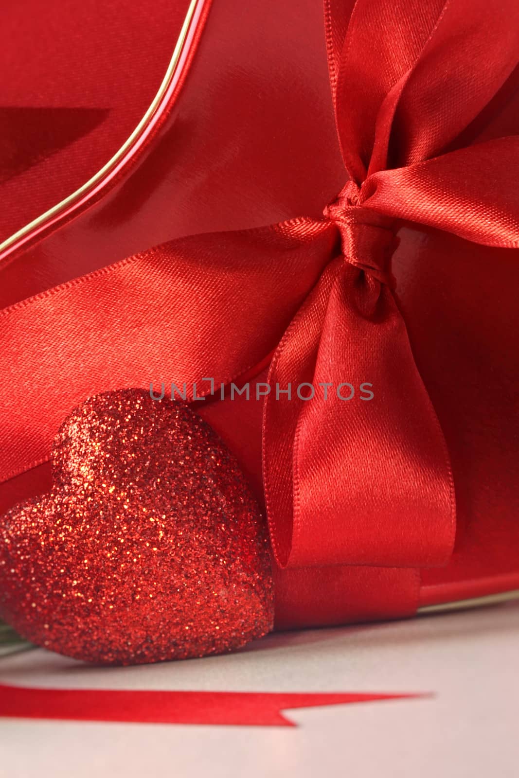 Closeup of hearts and red ribbons by Sandralise
