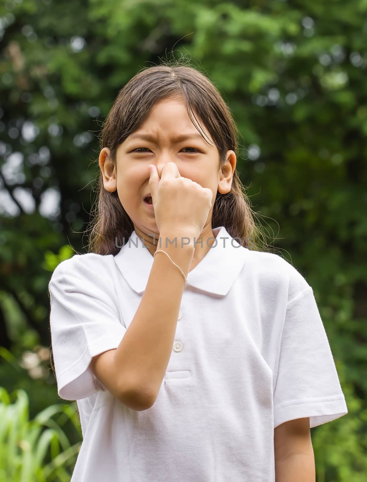 Outdoors portrait of beautiful Asian young girl