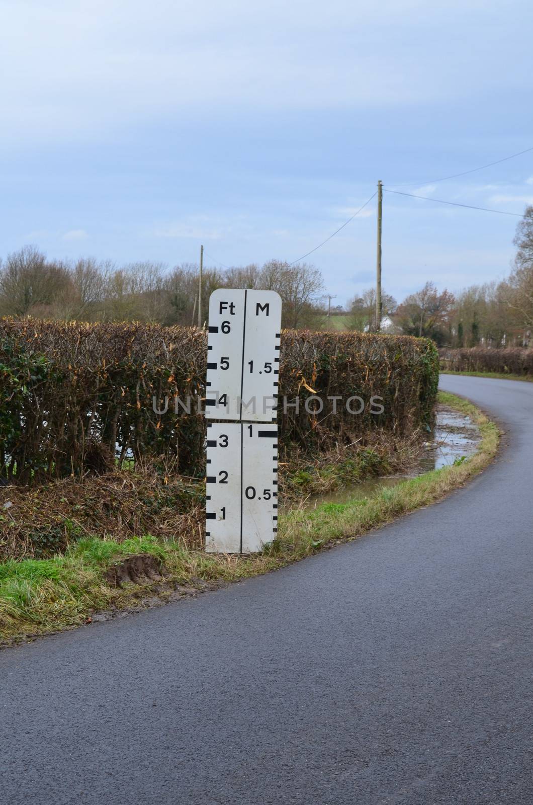 A roadside water level indictor that marks the depth of flood water which rises when the river near bursts its banks.