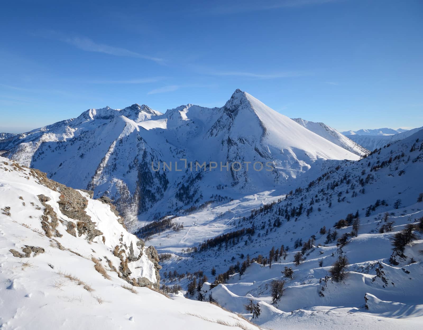 Stunning view of an elegant mountain peak (italian Alps) in winter time