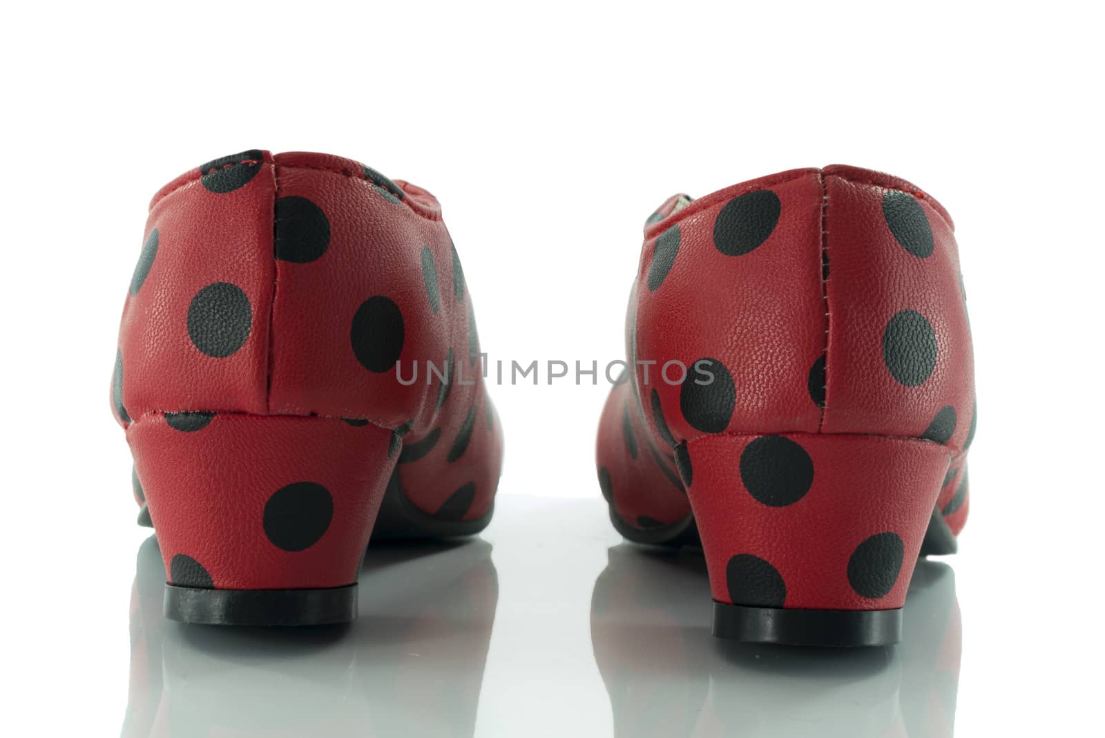 red shoes from back with black dots and white background