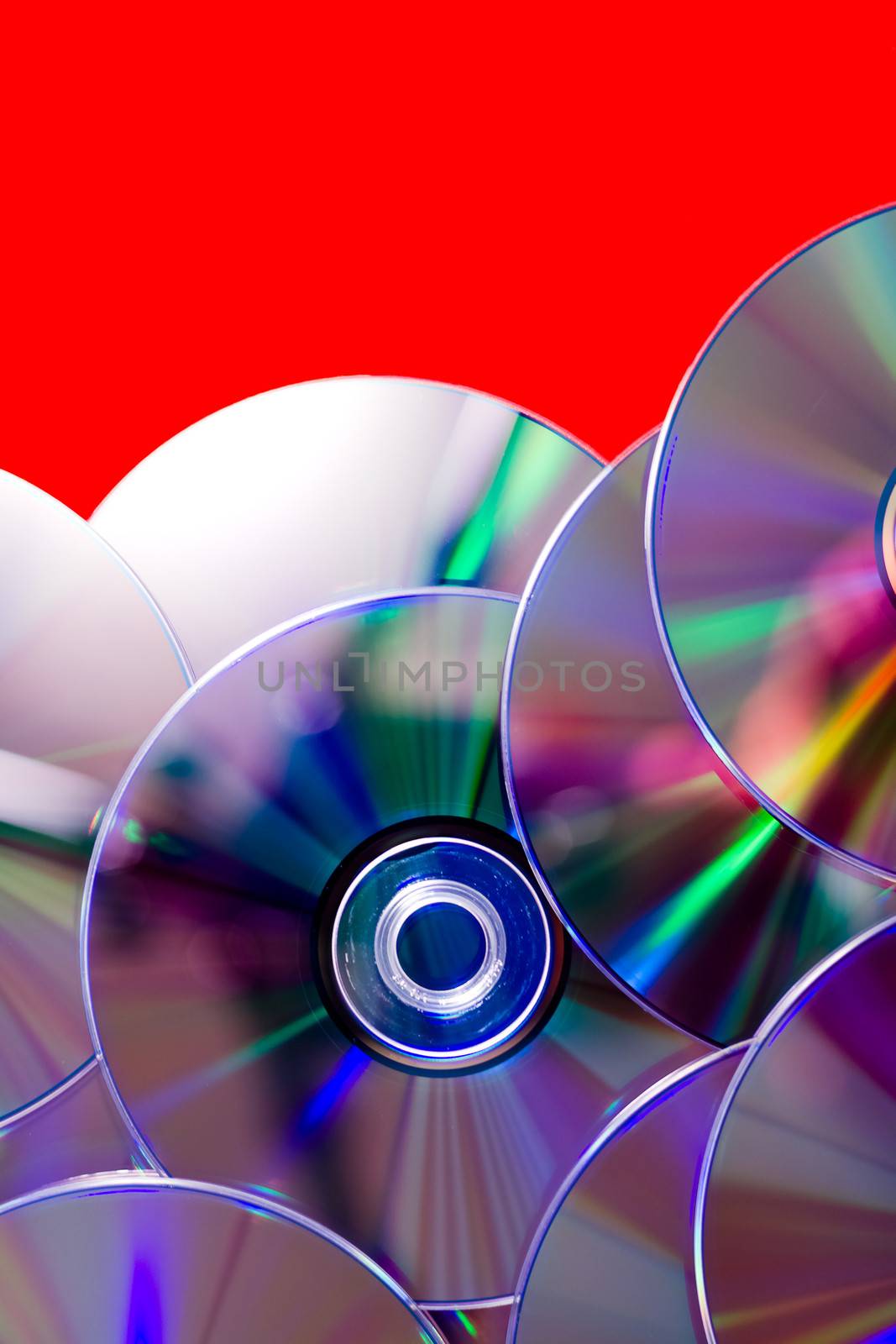 many CDs. Abstract background of rainbow discs