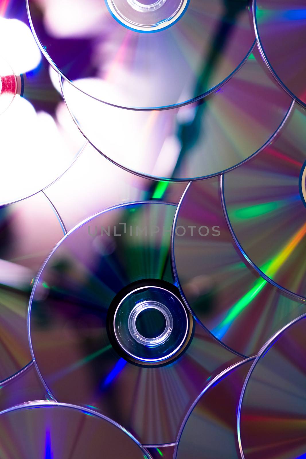 many CDs. Abstract background of rainbow discs