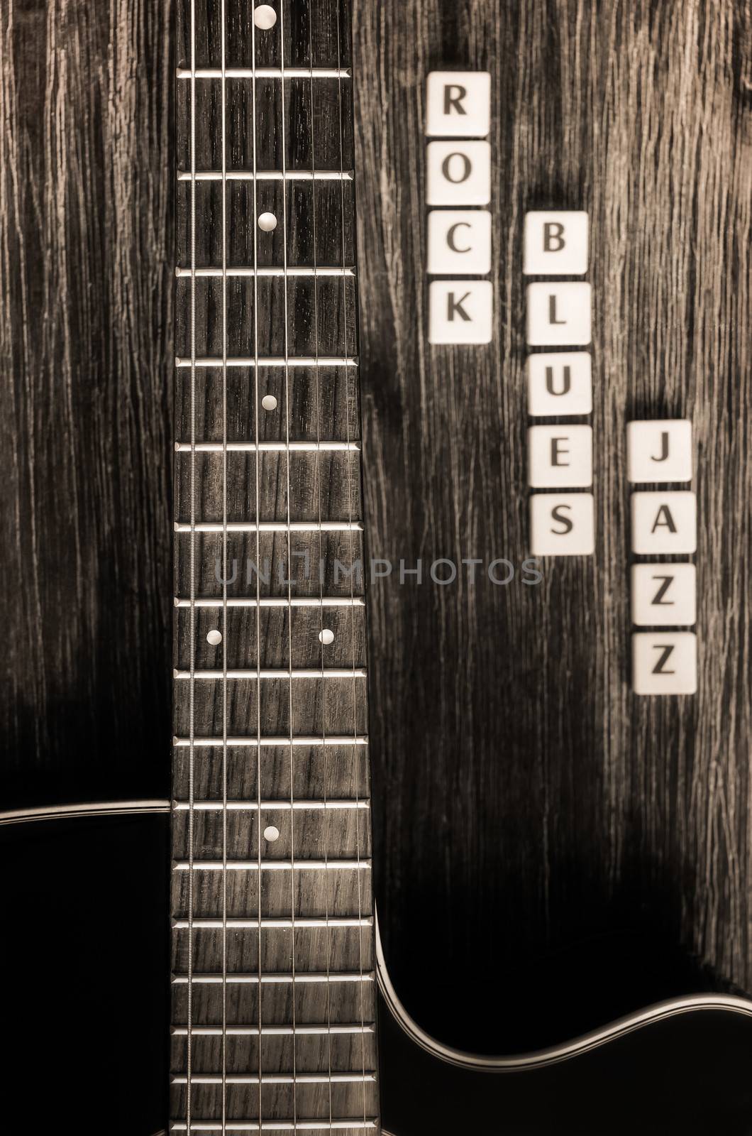 Monochrome detail of guitar and signs rock blues jazz in vintage style