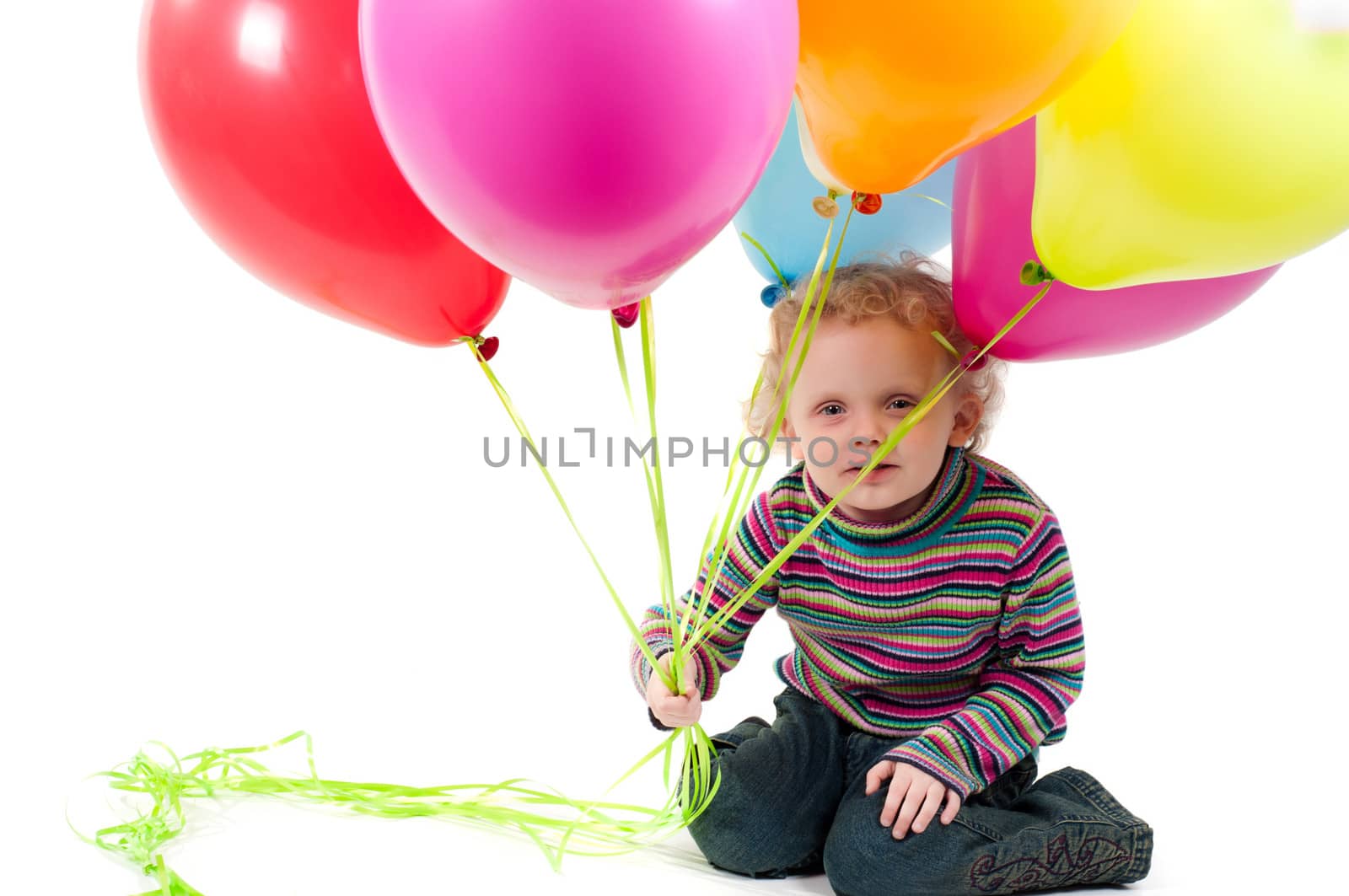 Shot of little cute girl with multicolored air balloons isolated on white