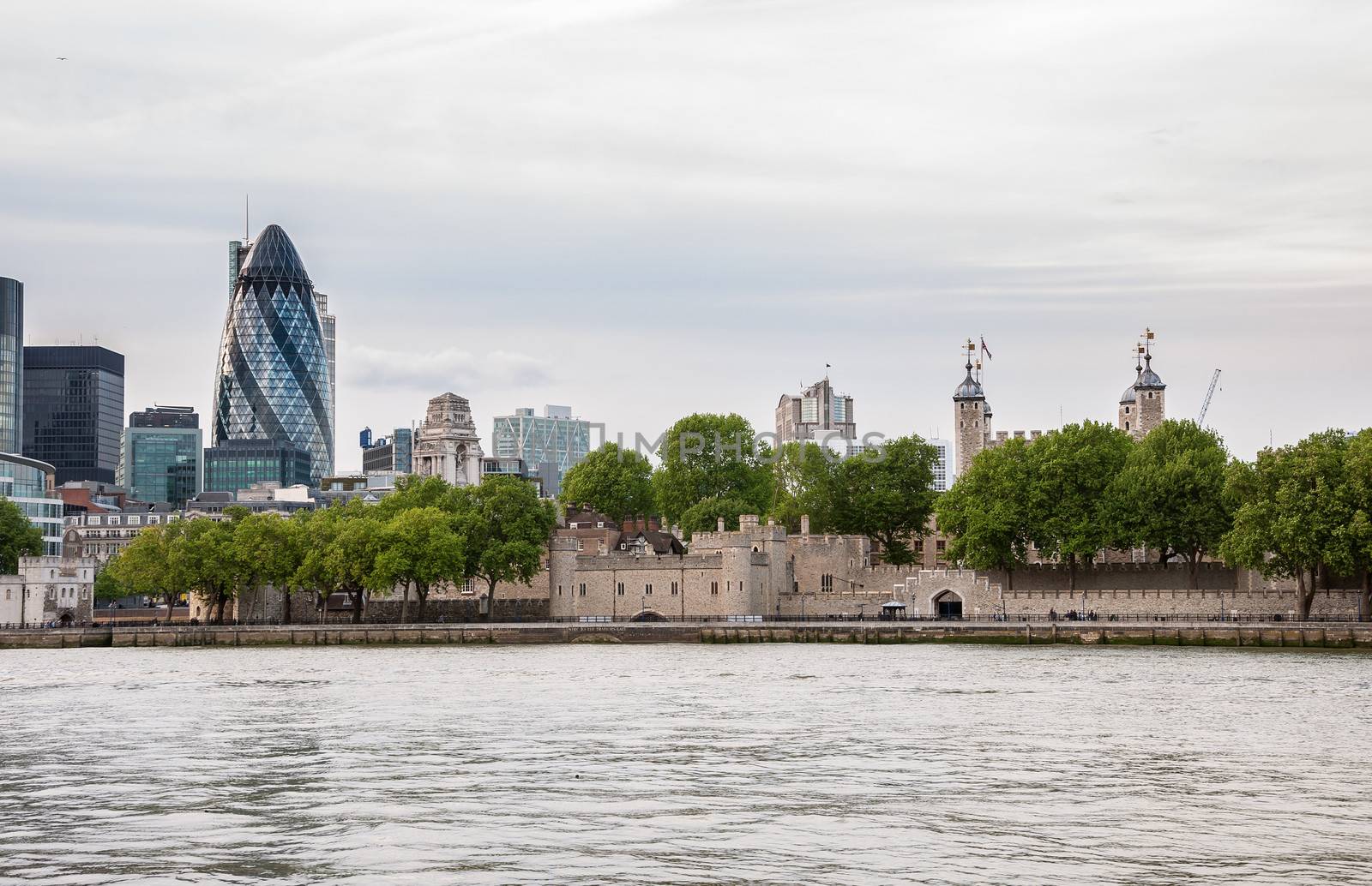 London skyline with Tower of London and Gherkin buildings on a cloudy day