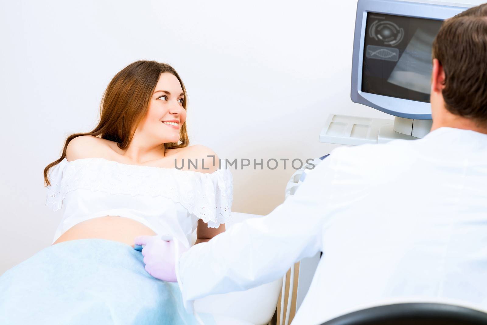 pregnant woman on reception at the doctor by adam121