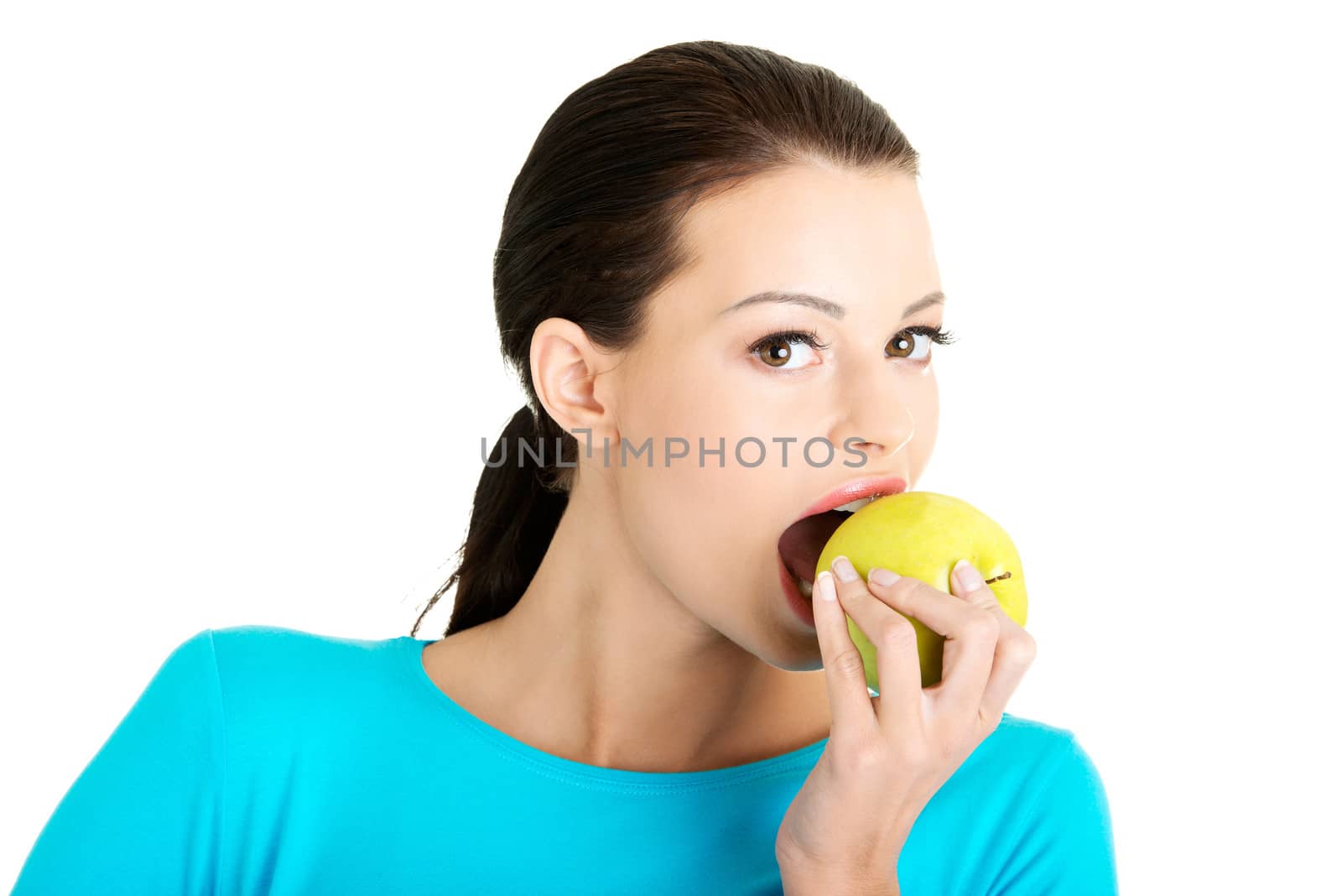 Young woman holding green fresh apple by BDS