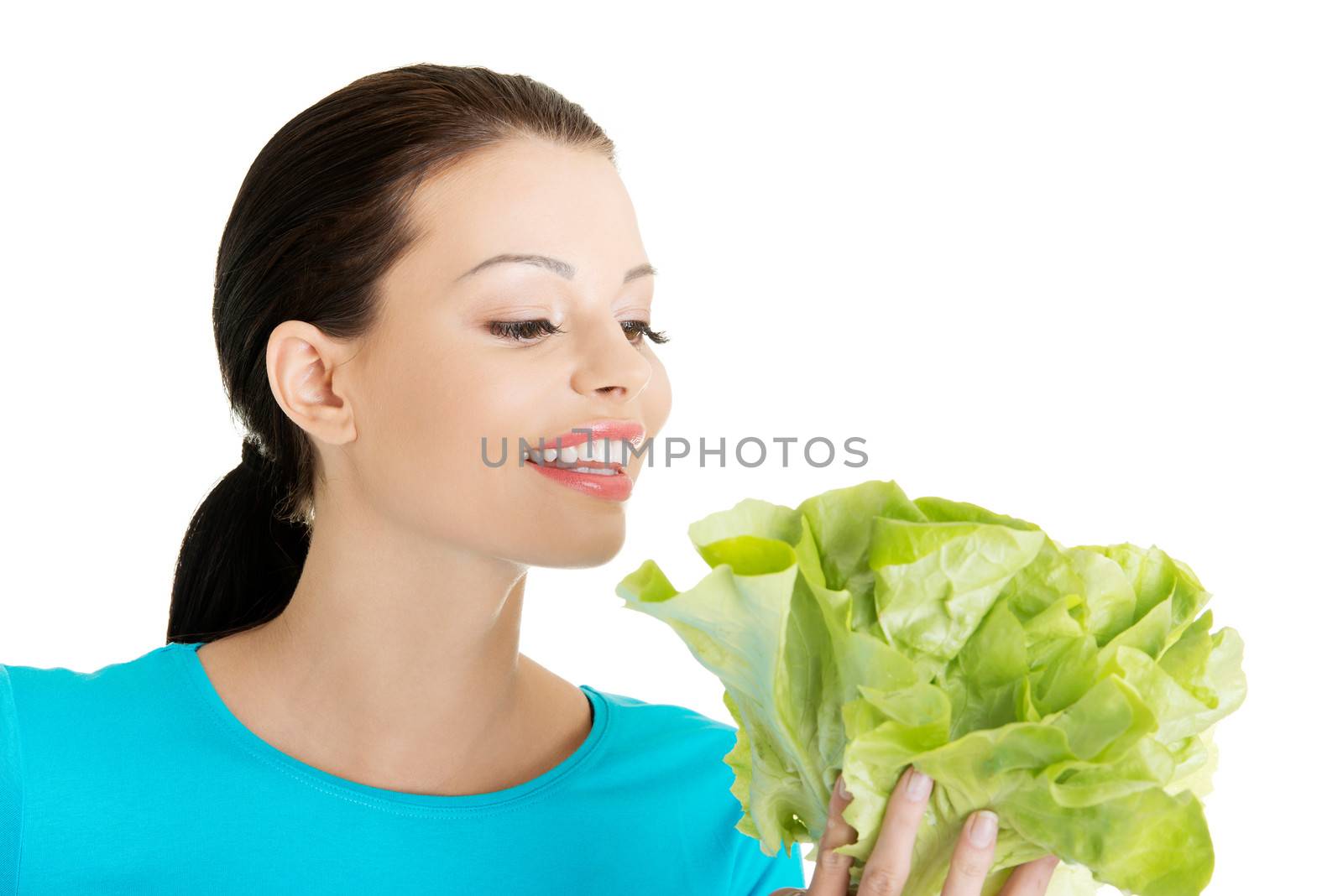 Attractive smiling woman with fresh salat by BDS