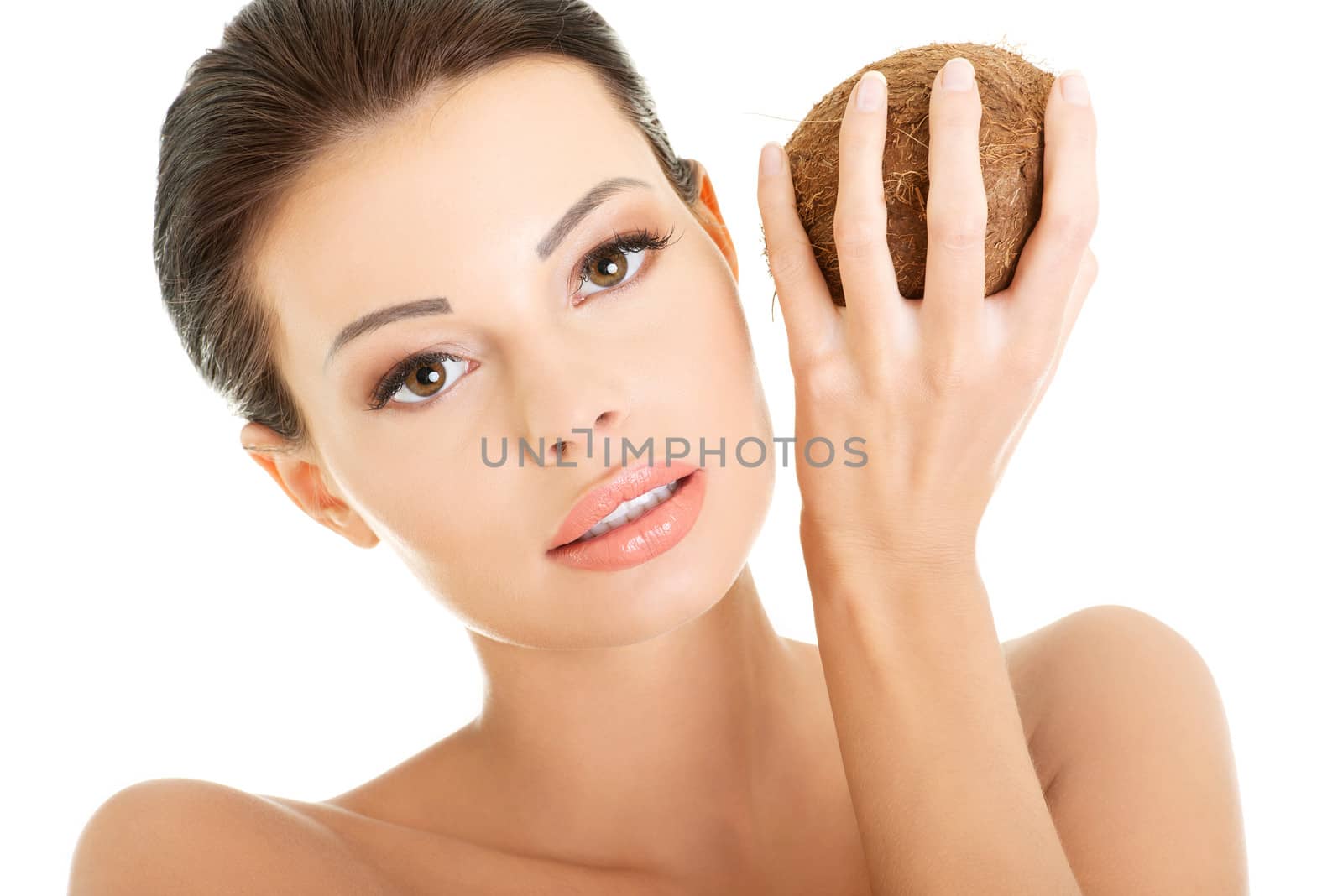 Beautiful woman with coconut in hands by BDS
