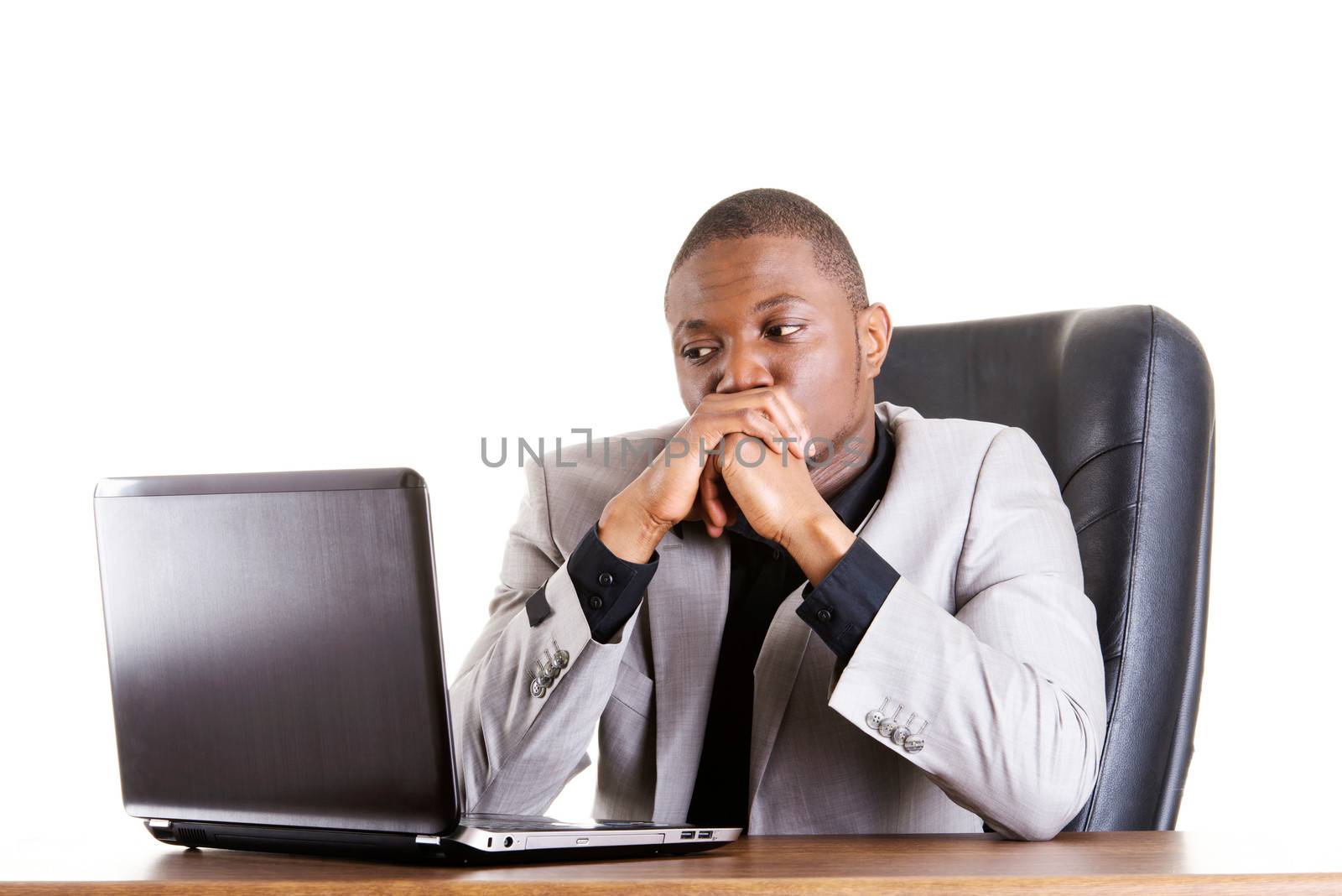Stressed businessman working on laptop, isolated on white