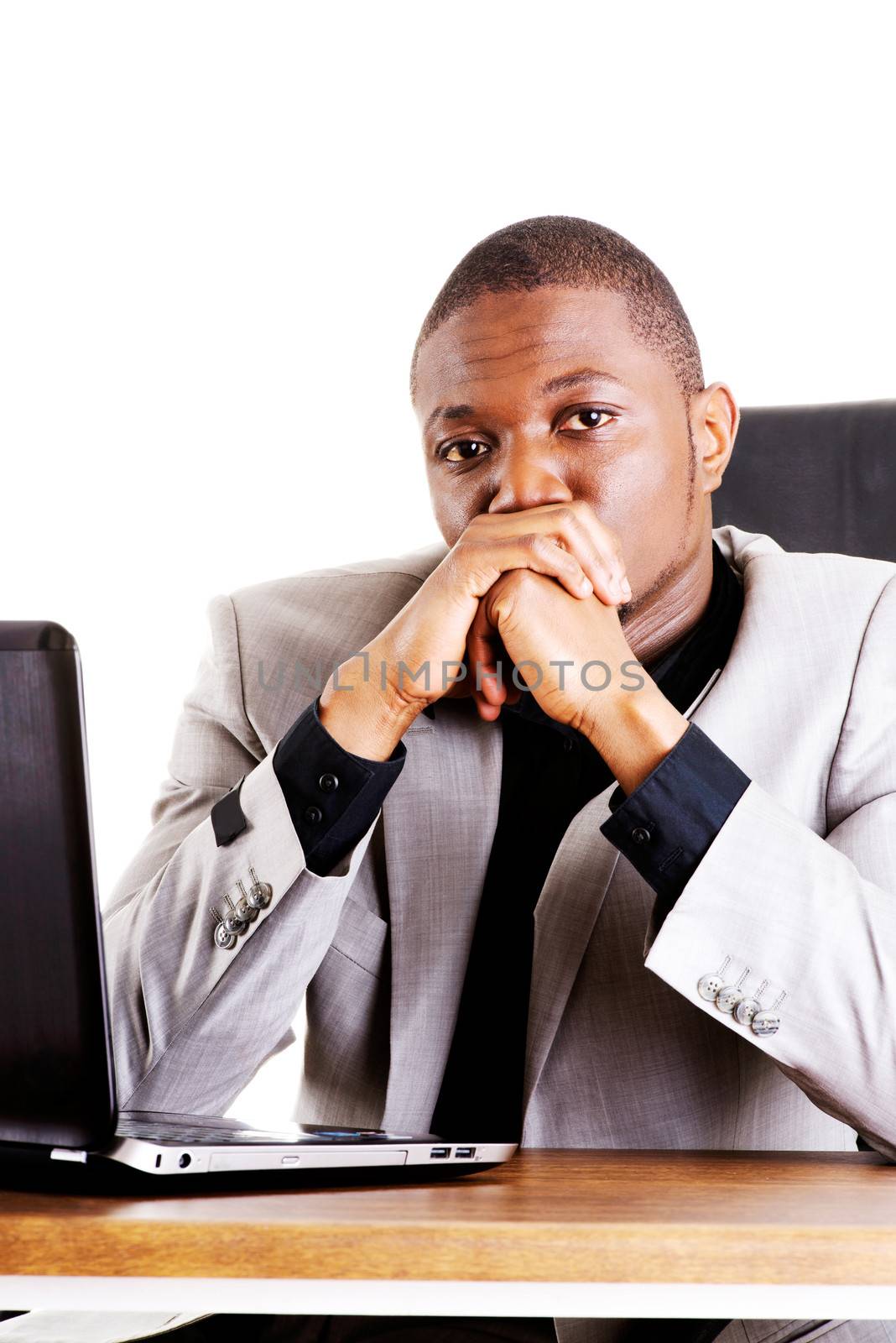 Stressed businessman working on laptop by BDS