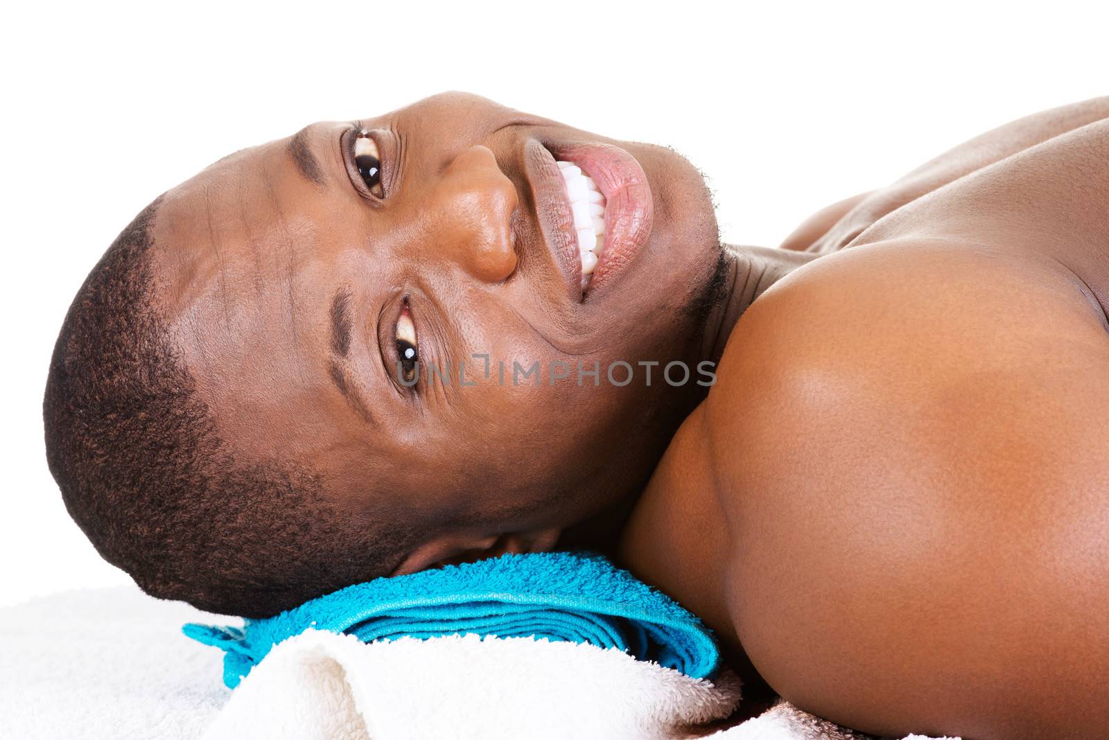 Man receiving massage at spa saloon