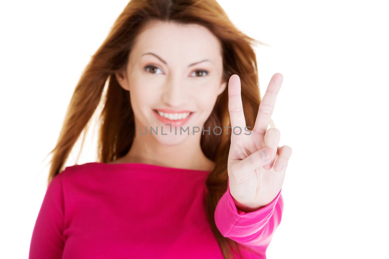 Happy woman showing victory sign