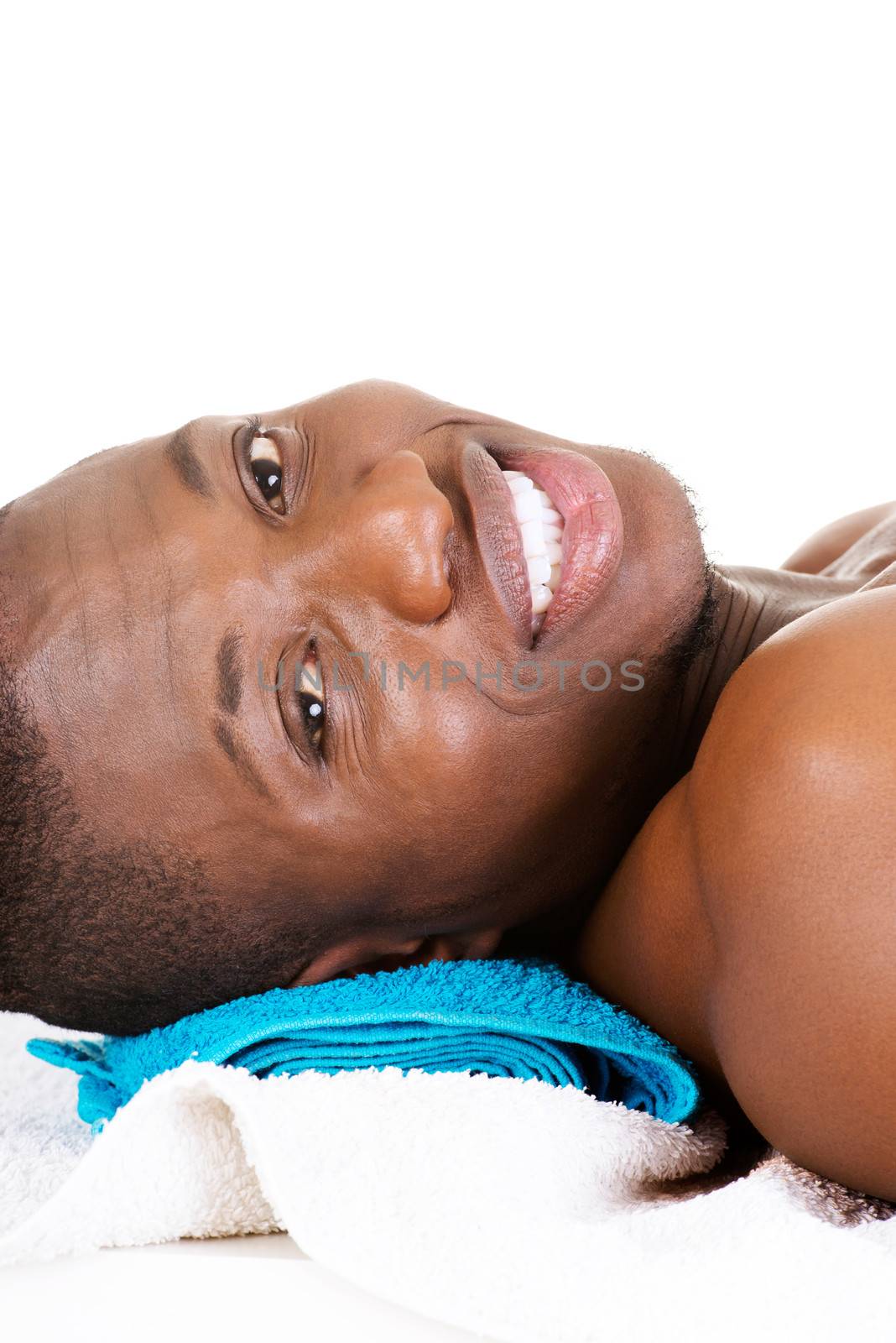 Man receiving massage at spa saloon